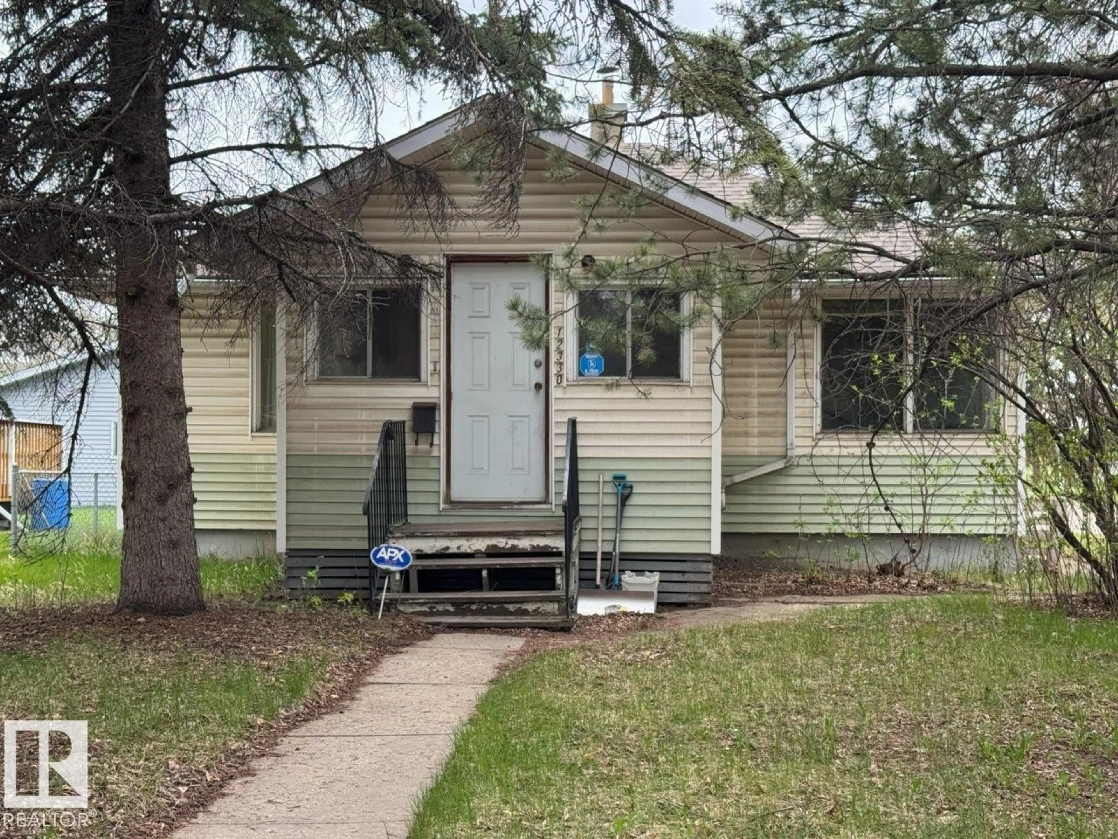 Home with vinyl exterior material, street for 12330 106 ST, Edmonton Alberta T5G2S2