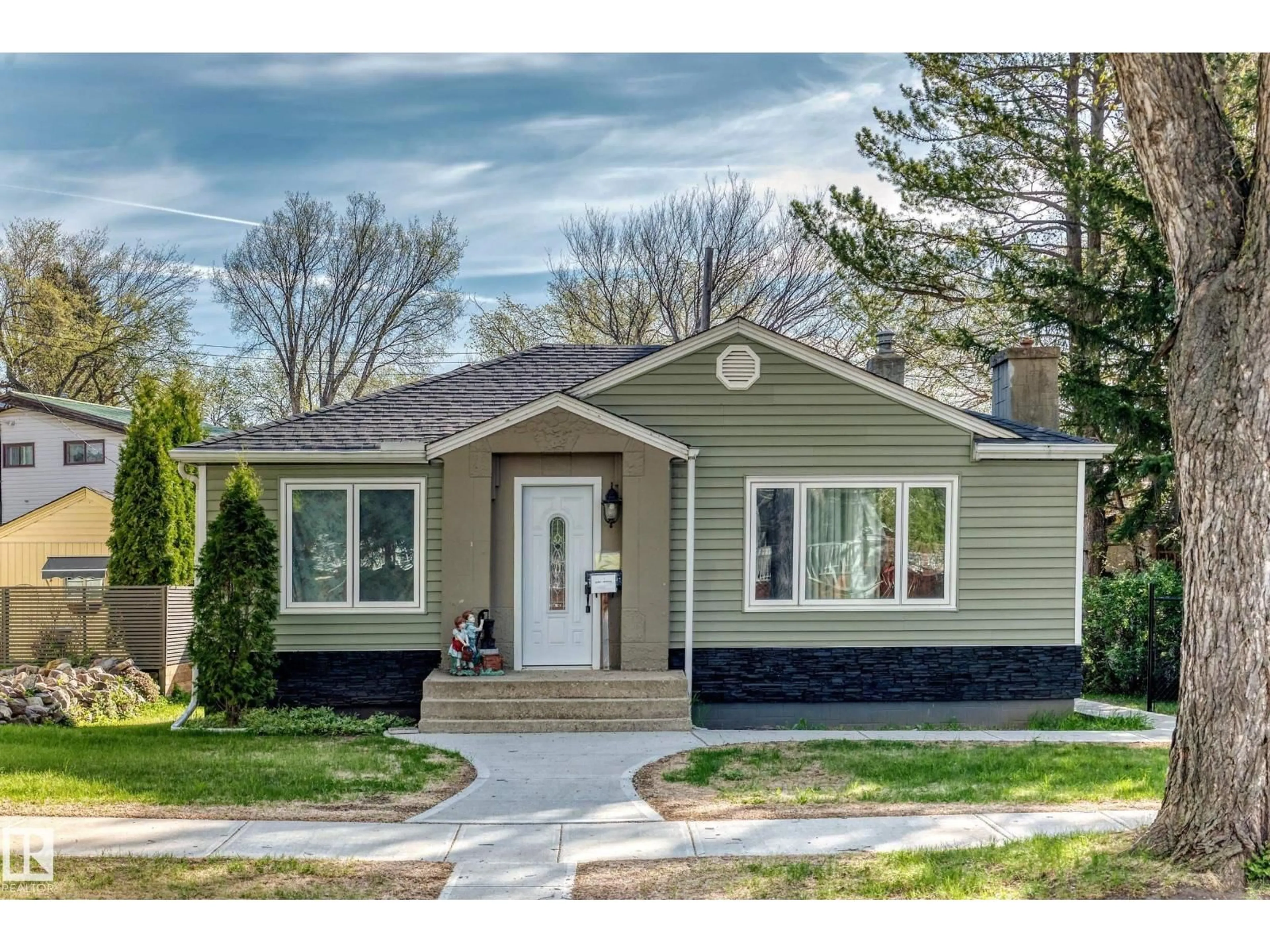 Home with vinyl exterior material, street for 11303 60 ST, Edmonton Alberta T5W3Z2