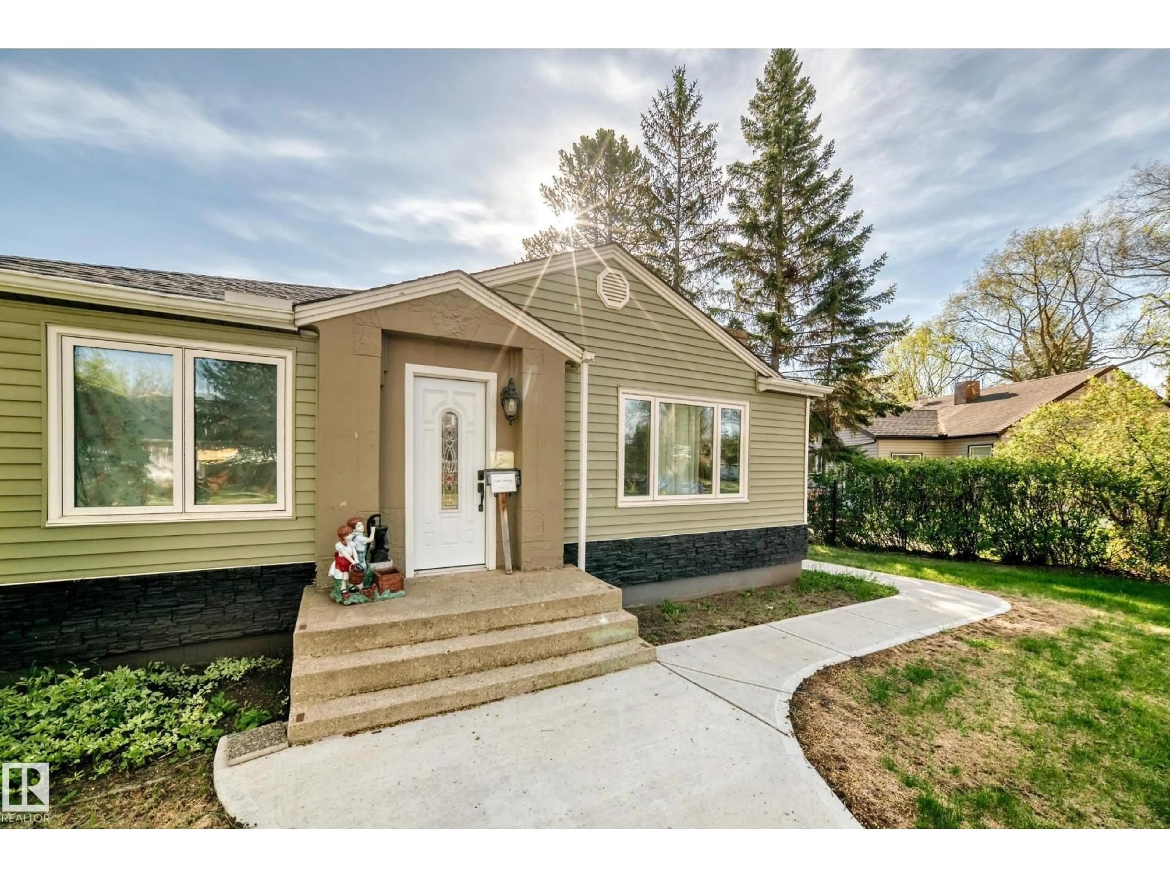 Home with vinyl exterior material, street for 11303 60 ST, Edmonton Alberta T5W3Z2