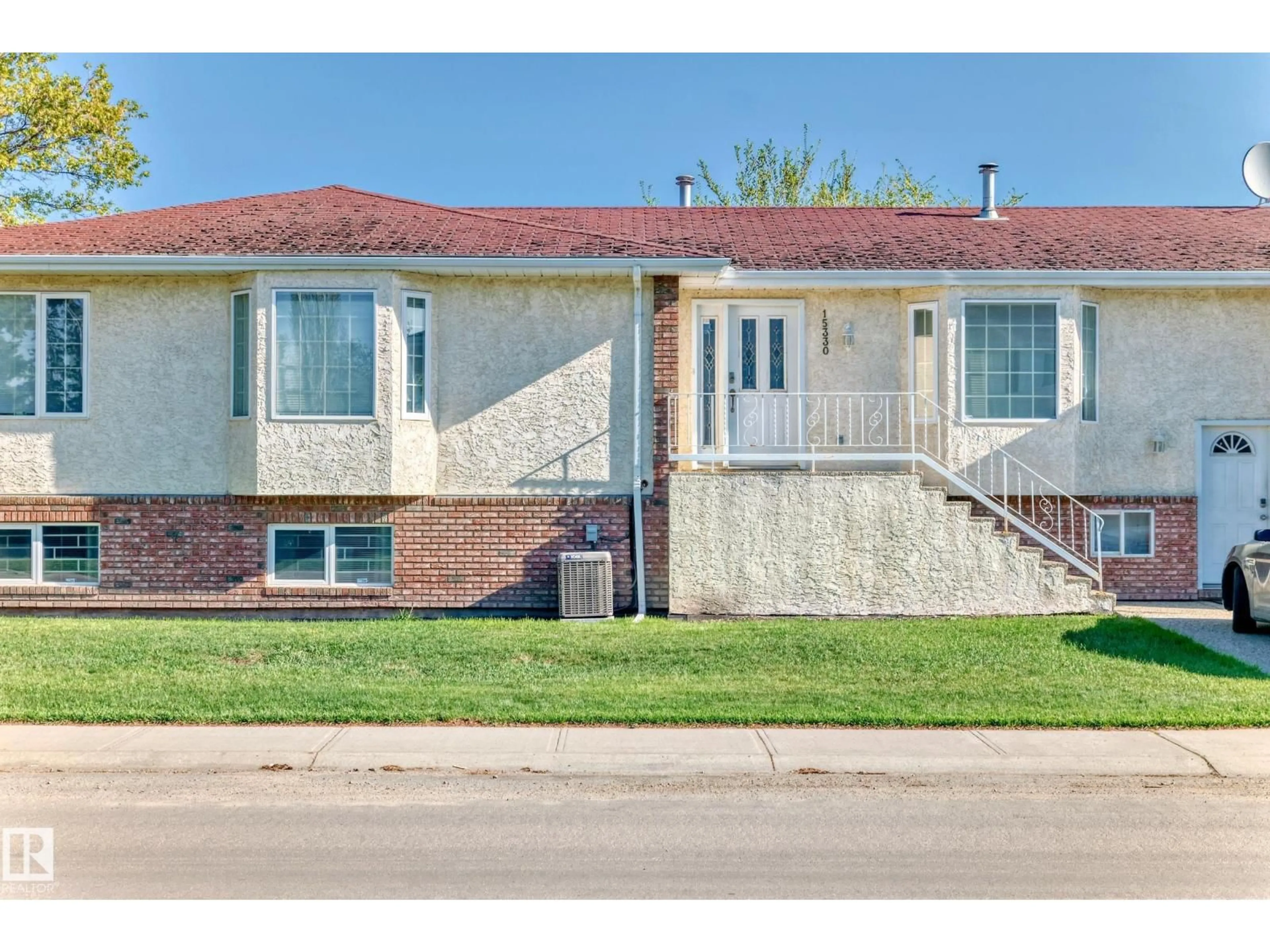 Home with brick exterior material, street for 15330 99 AV, Edmonton Alberta T5P0H9