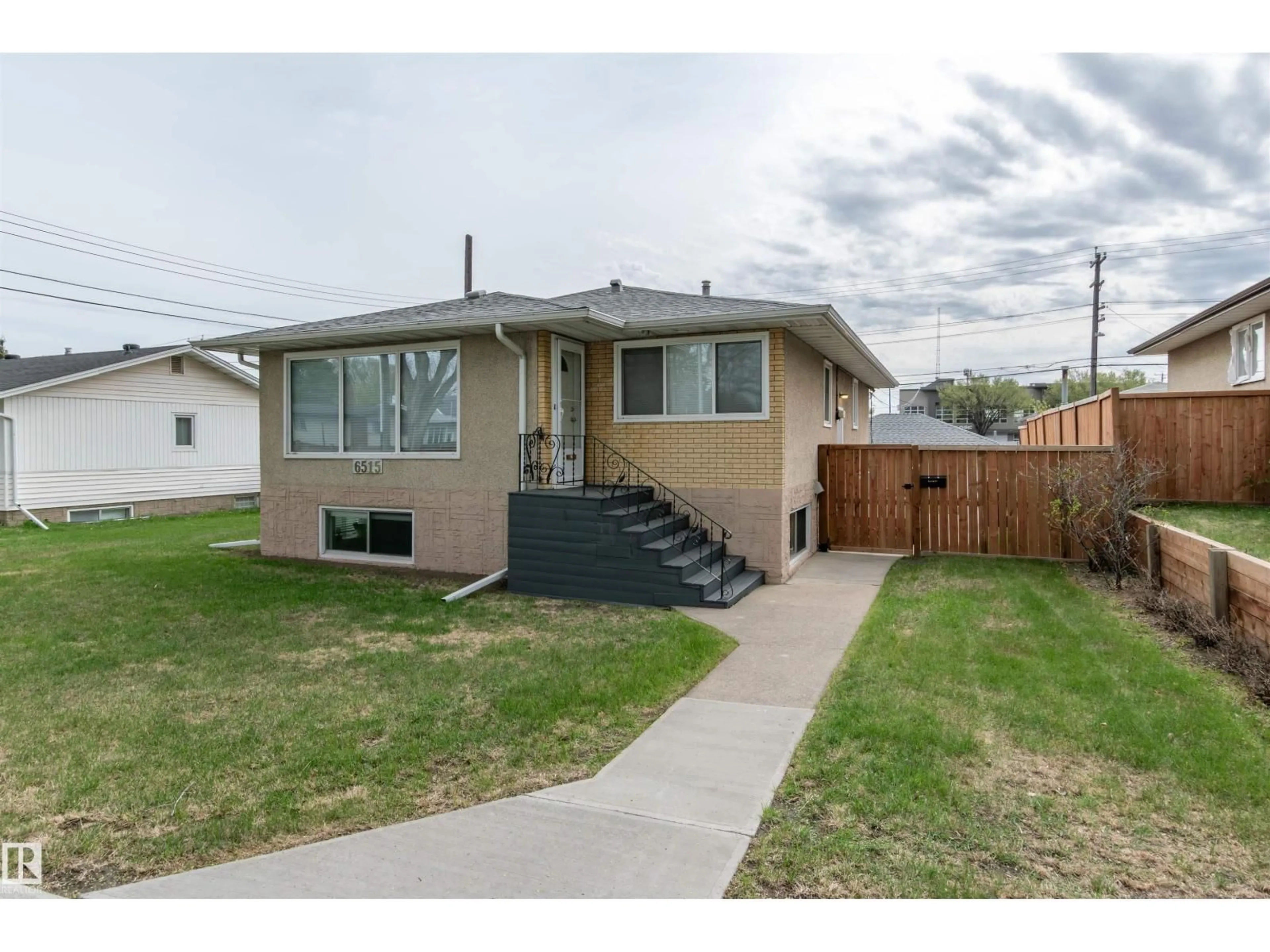 Home with vinyl exterior material, street for NW - 6515 104 A ST, Edmonton Alberta T6Y2M2