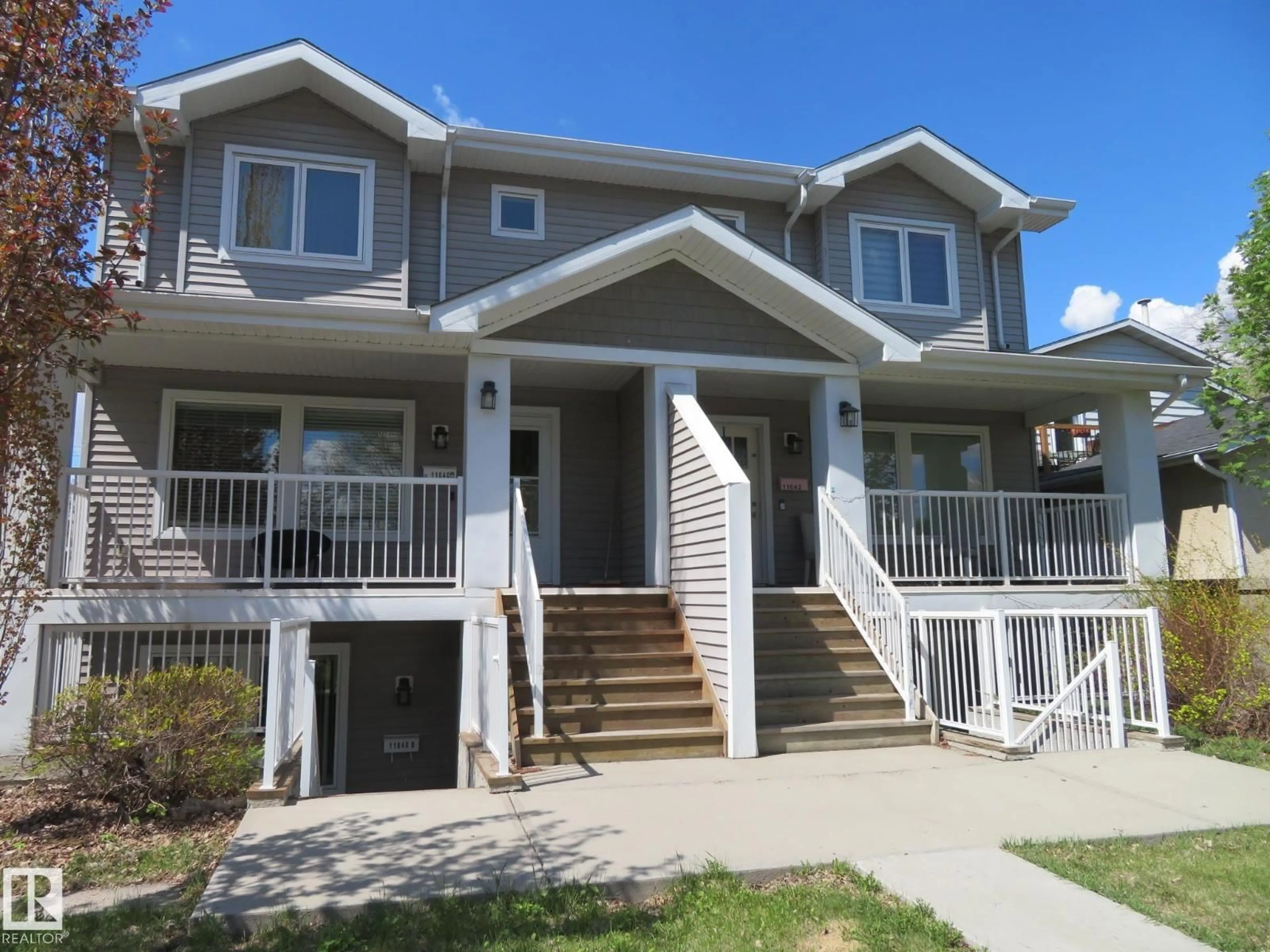 Home with vinyl exterior material, street for 11840 112 ST, Edmonton Alberta T5L0C2