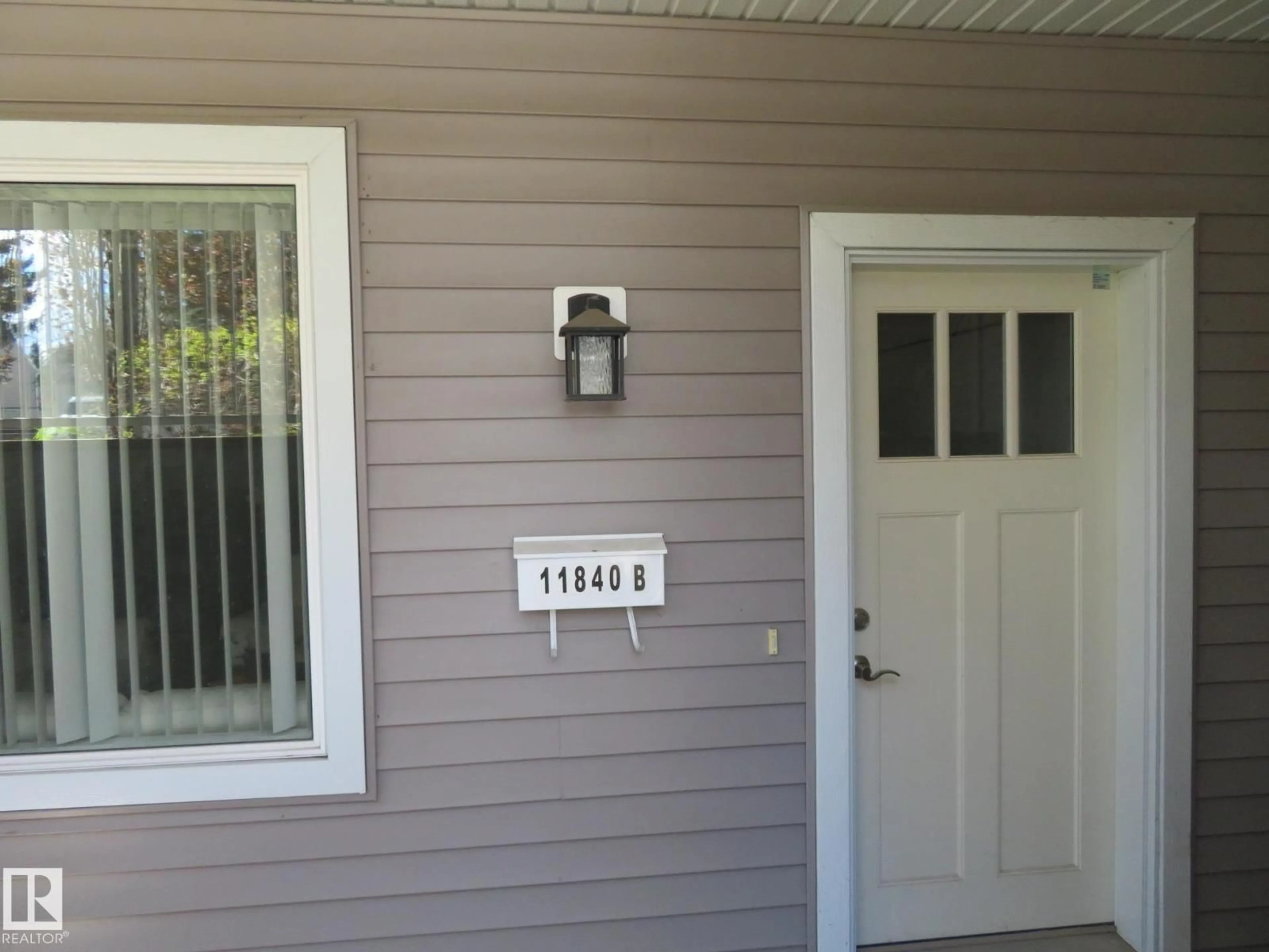Home with vinyl exterior material, street for 11840 112 ST, Edmonton Alberta T5L0C2