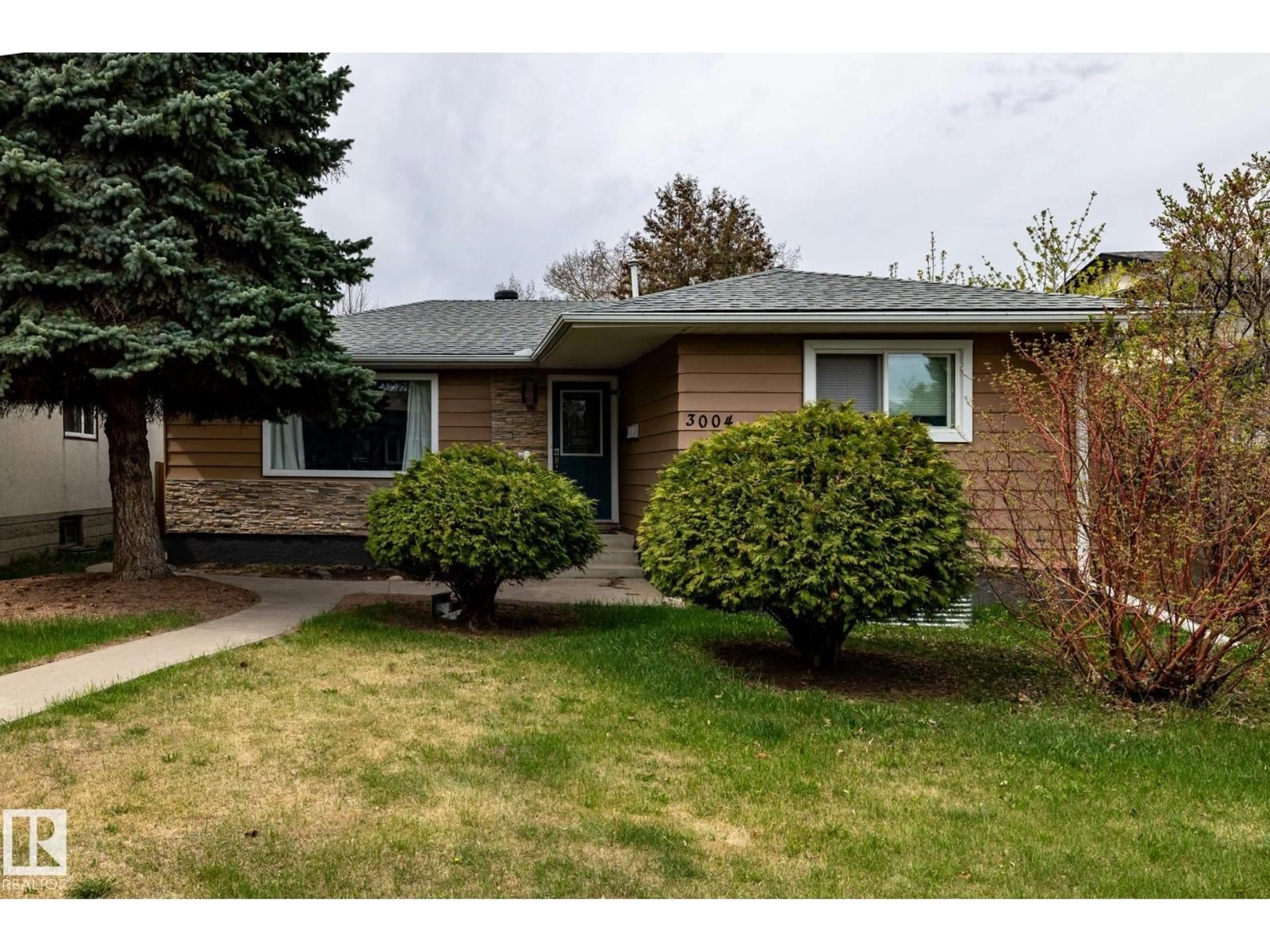 Home with brick exterior material, street for 3004 68 ST, Edmonton Alberta T6K1N6