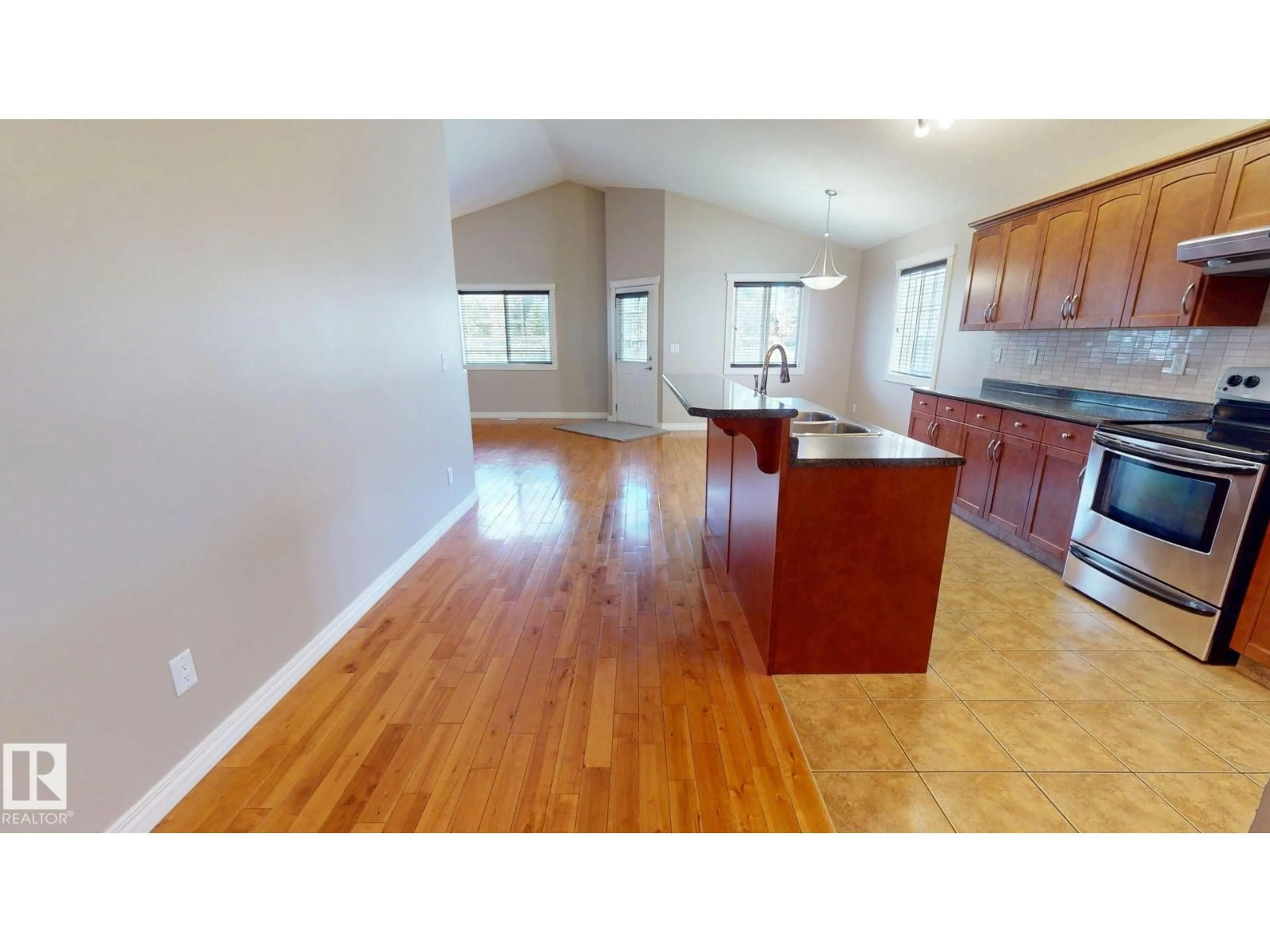 Open concept kitchen, wood/laminate floor for 16408 49 ST NW, Edmonton Alberta T5Y0A5
