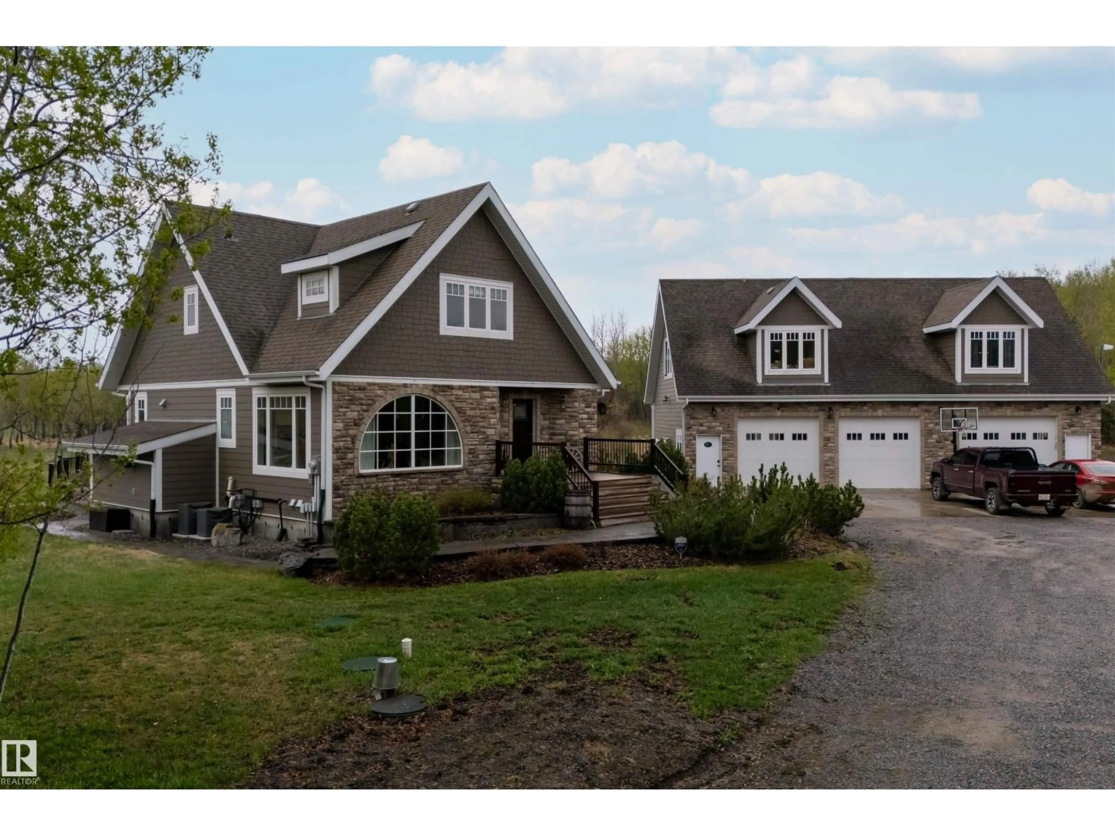 Home with vinyl exterior material, street for 27317 TWP ROAD 554, Rural Sturgeon County Alberta T8R2B3