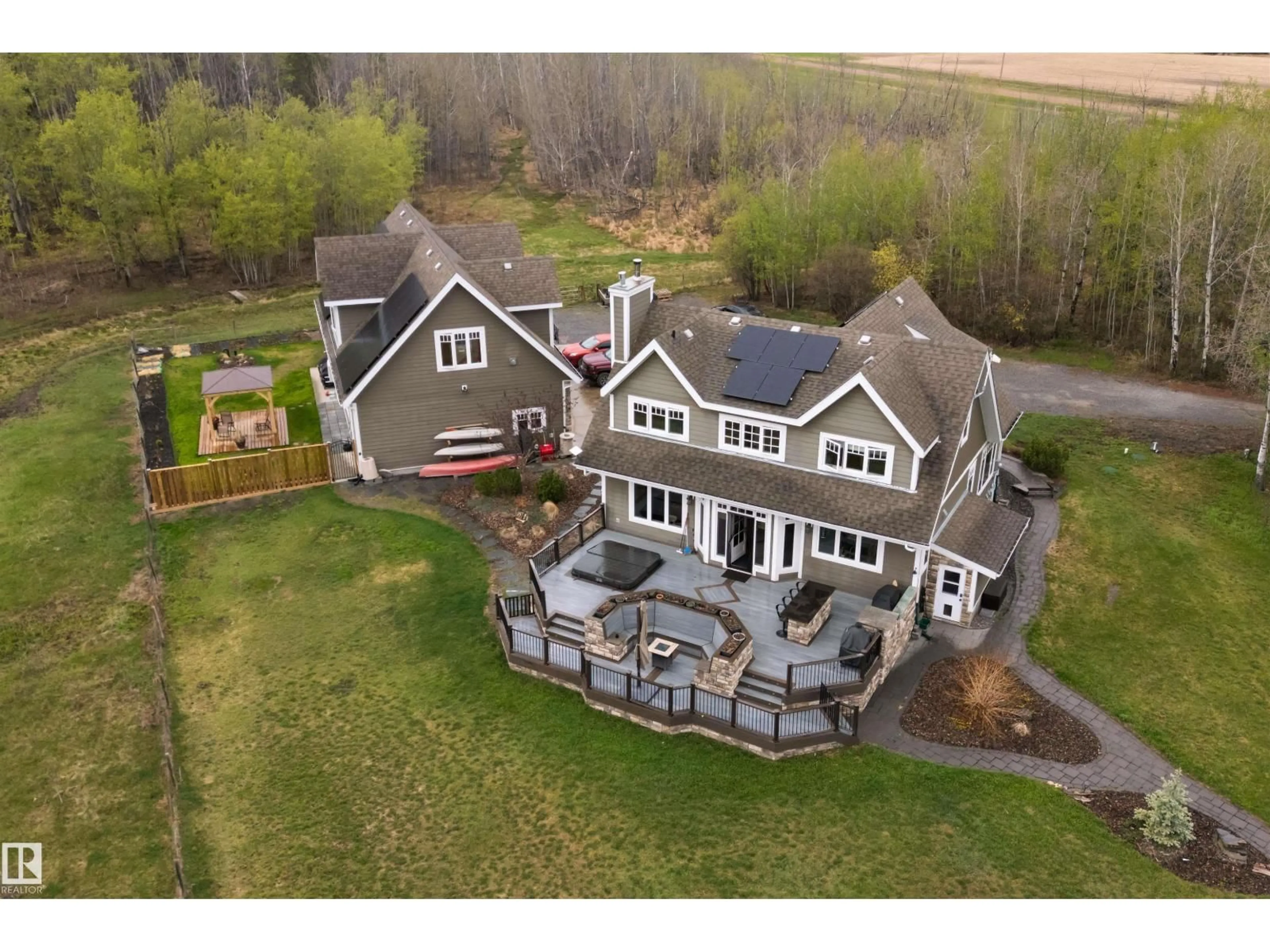 A pic from outside/outdoor area/front of a property/back of a property/a pic from drone, unknown for 27317 TWP ROAD 554, Rural Sturgeon County Alberta T8R2B3