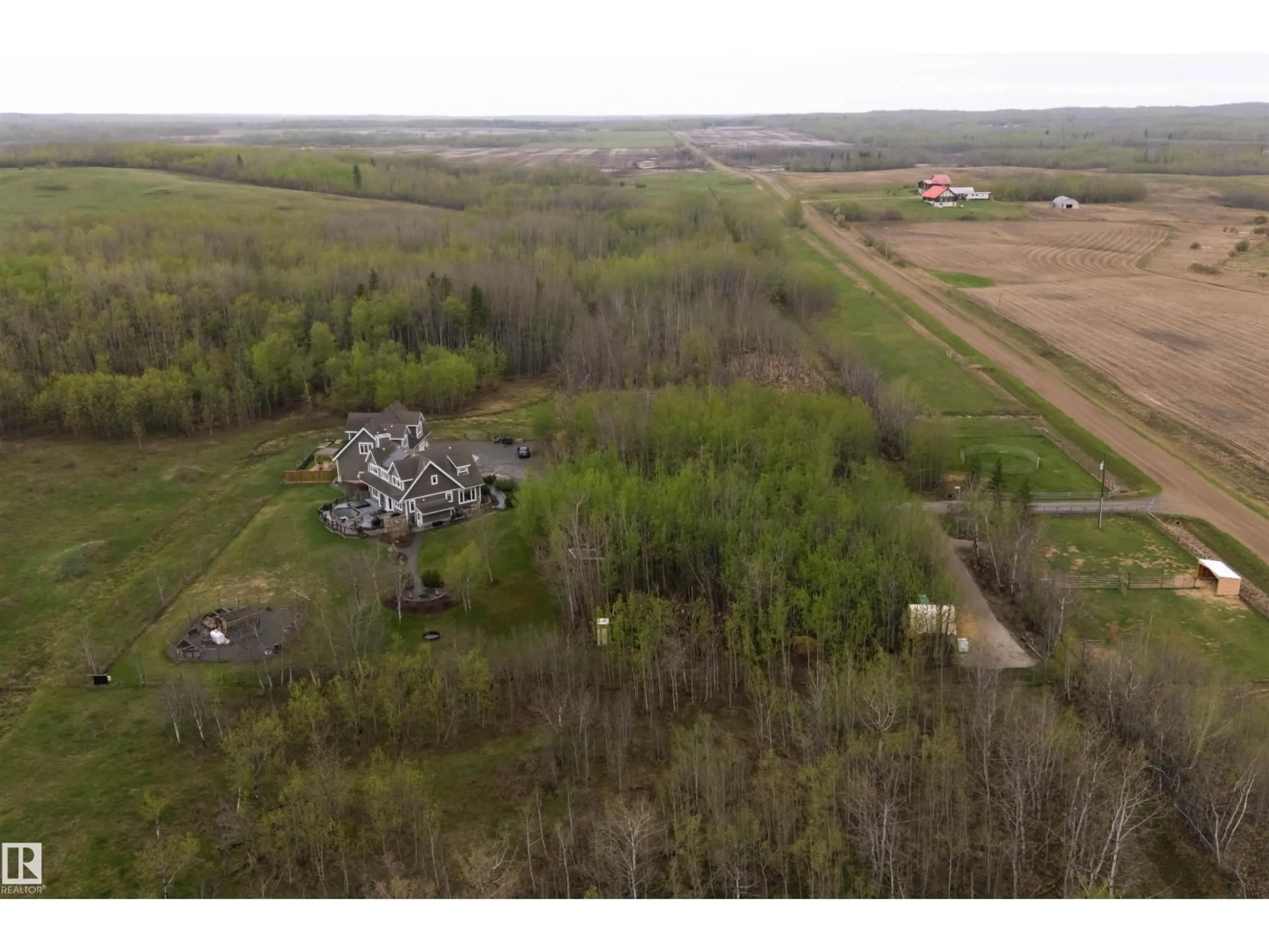 A pic from outside/outdoor area/front of a property/back of a property/a pic from drone, building for 27317 TWP ROAD 554, Rural Sturgeon County Alberta T8R2B3