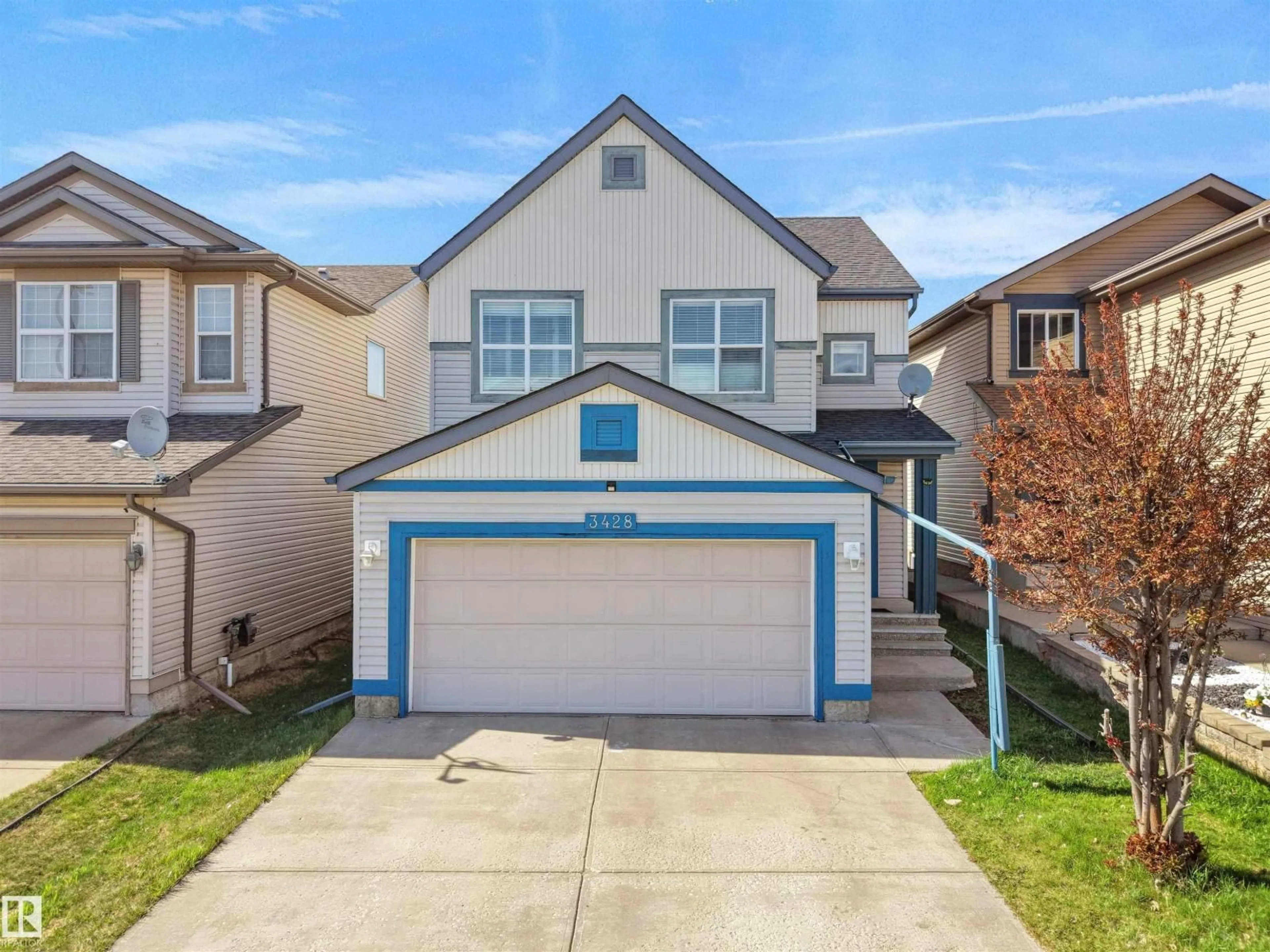 Home with vinyl exterior material, street for 3428 28 ST, Edmonton Alberta T6T2A5