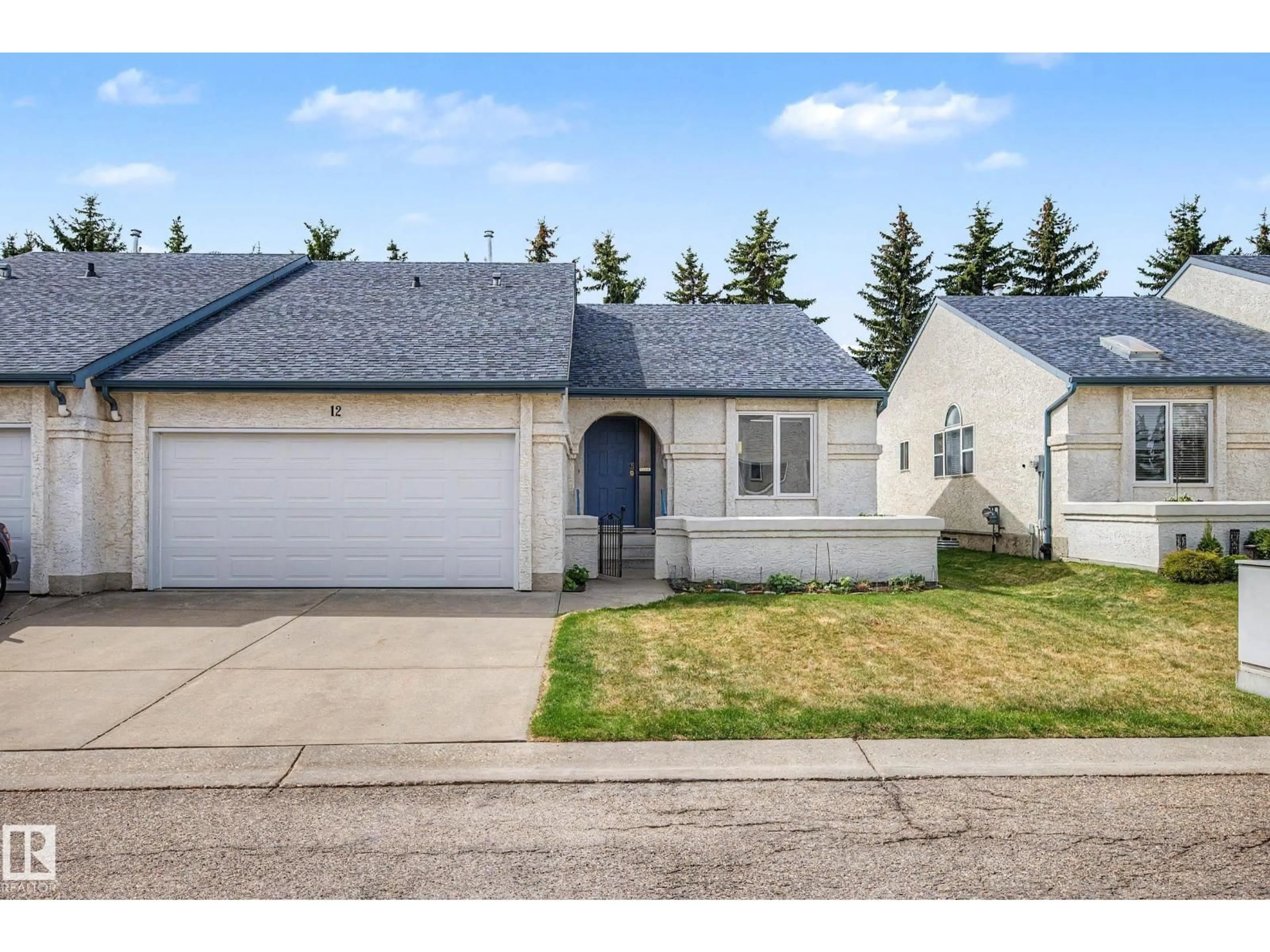 Home with vinyl exterior material, street for 12 9718 176 ST NW, Edmonton Alberta T6L1W3