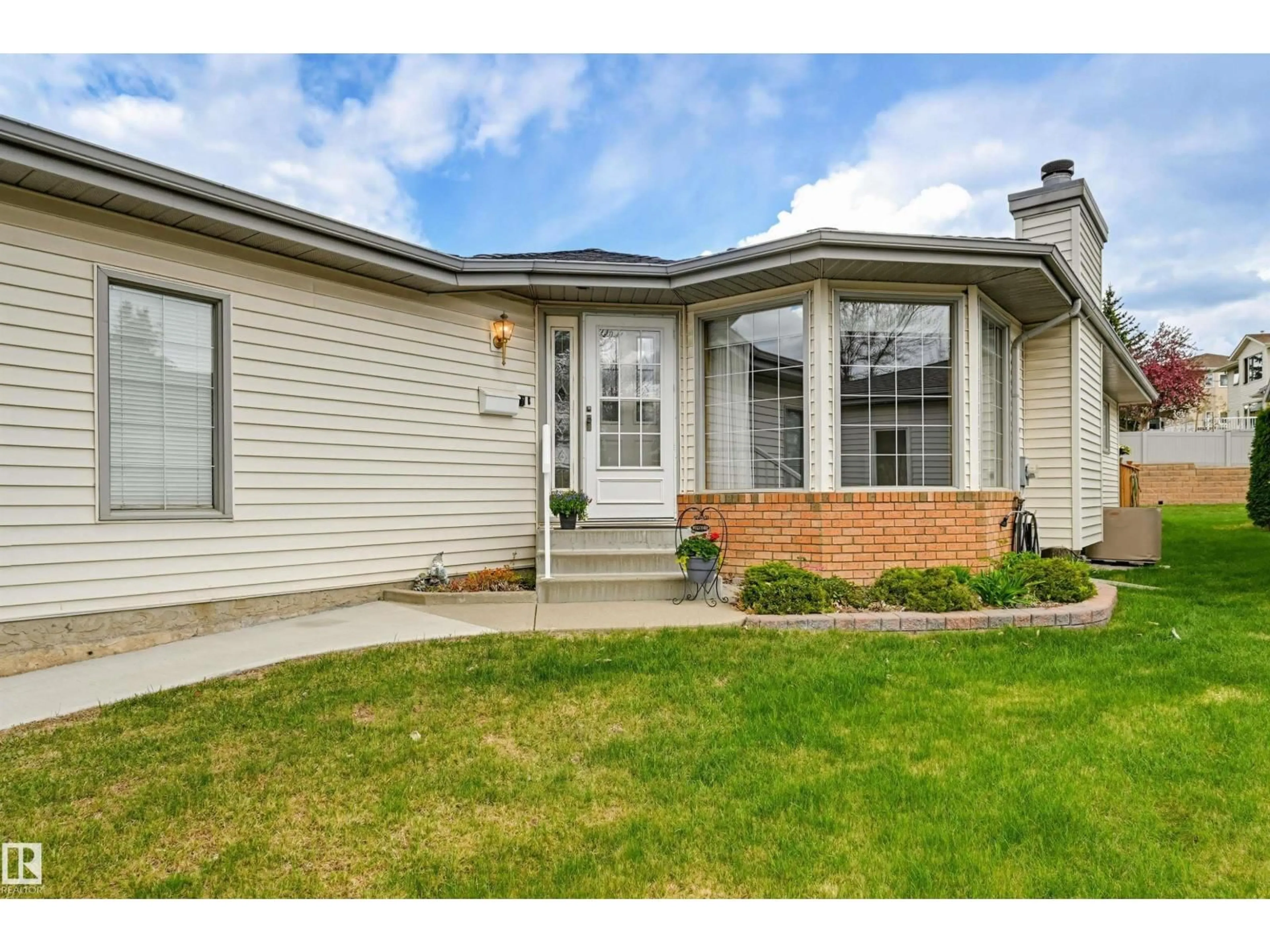 Home with vinyl exterior material, street for 604 REVELL WD, Edmonton Alberta T6R2H9