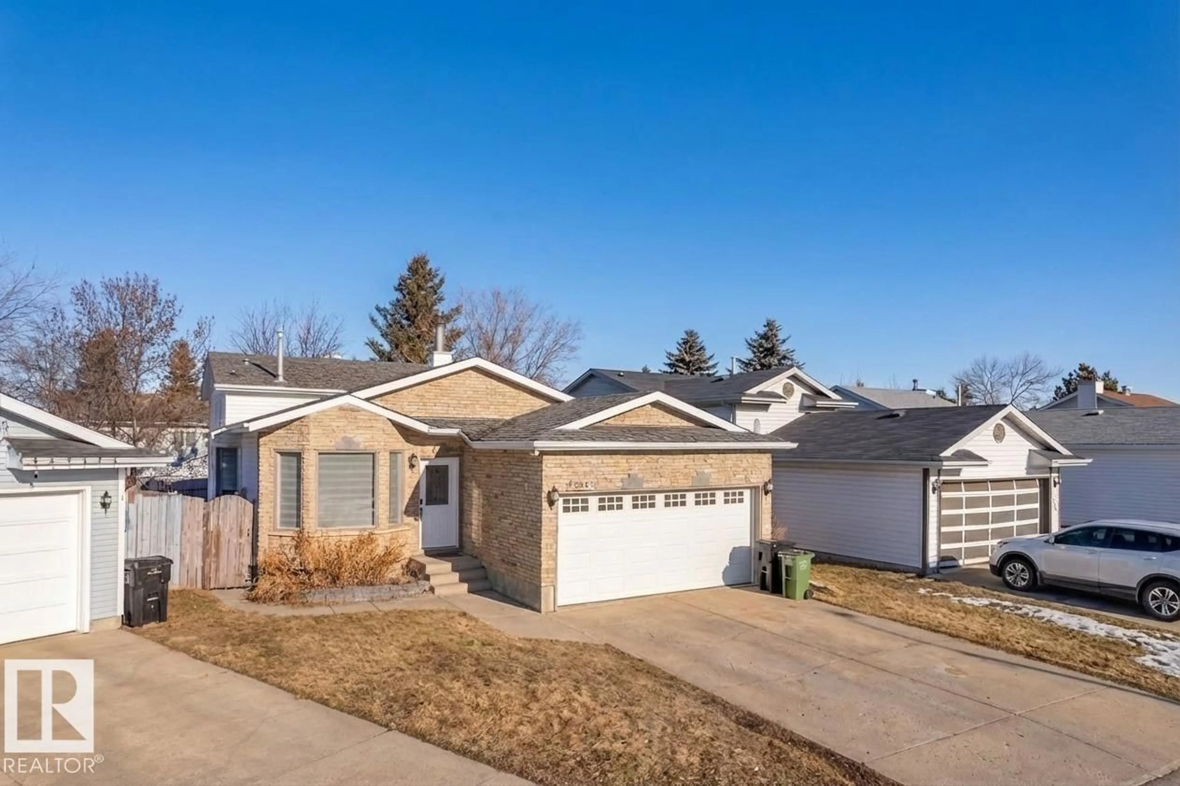 Home with vinyl exterior material, street for 2536 35 ST, Edmonton Alberta T6L4G3