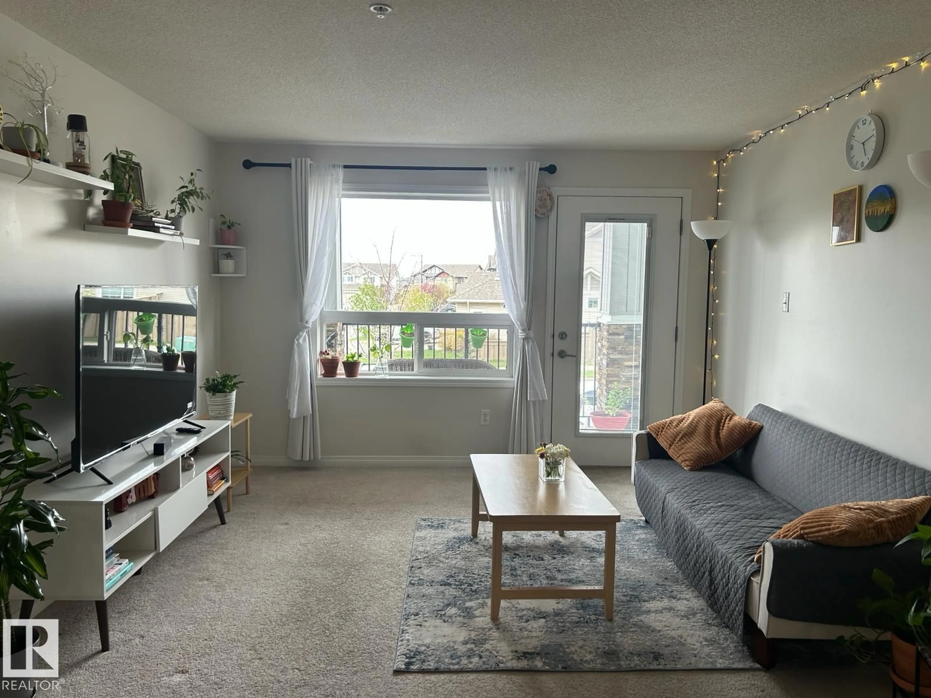 Living room with furniture, unknown for 9363 - 1228 SIMPSON DR, Edmonton Alberta T6R0N2
