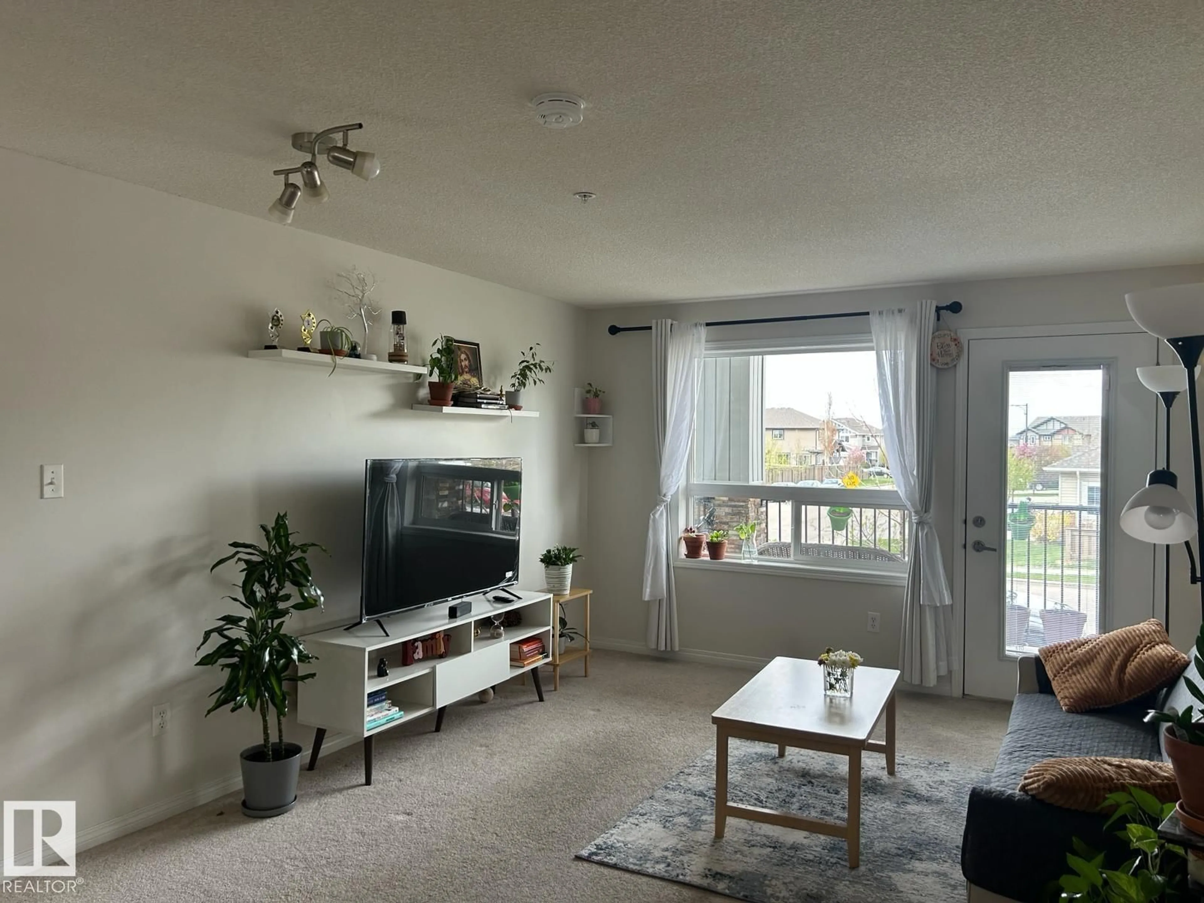 Living room with furniture, unknown for 9363 - 1228 SIMPSON DR, Edmonton Alberta T6R0N2