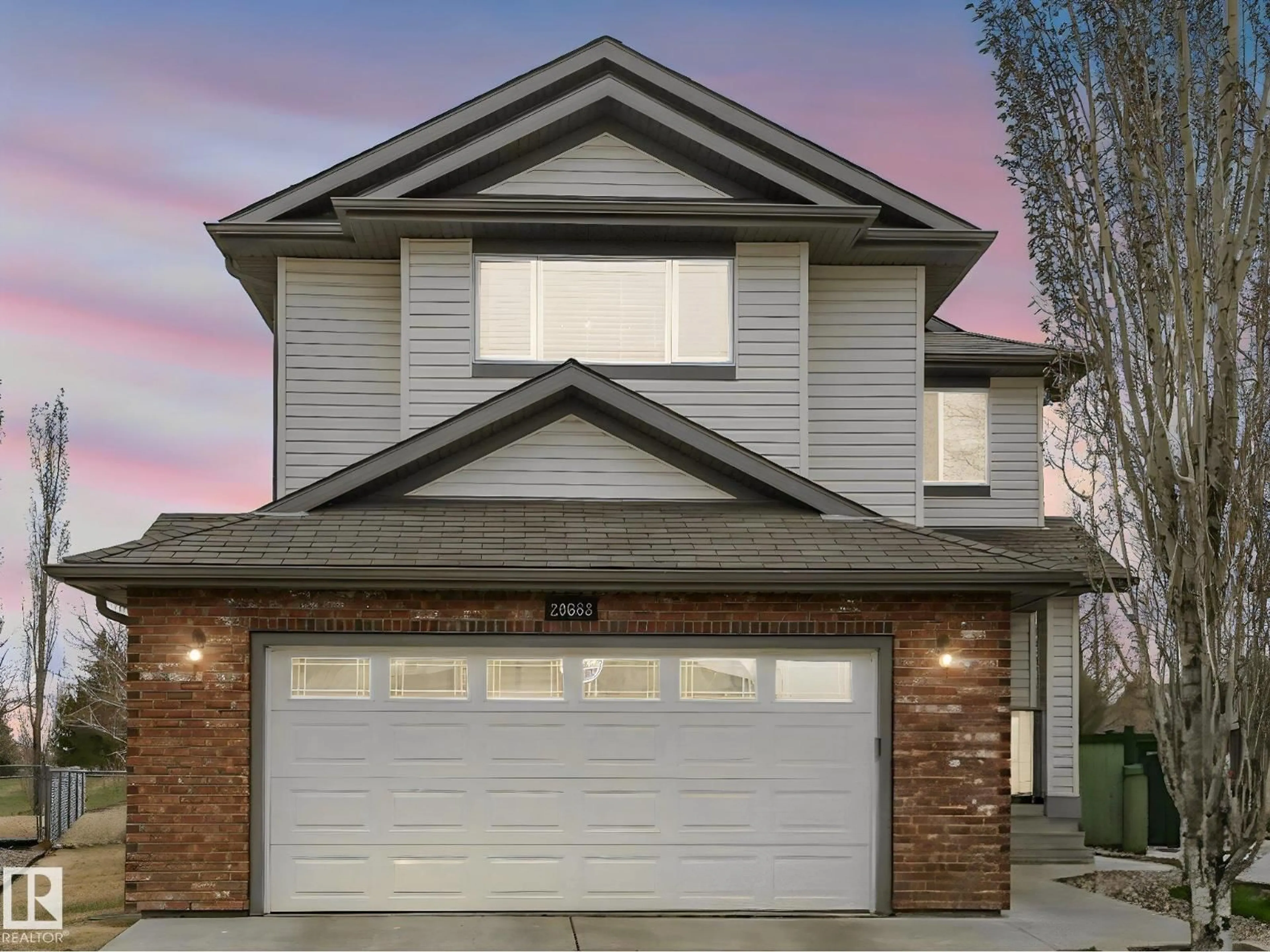 Home with vinyl exterior material, street for 20853 92A AV NW, Edmonton Alberta T5T3Z1