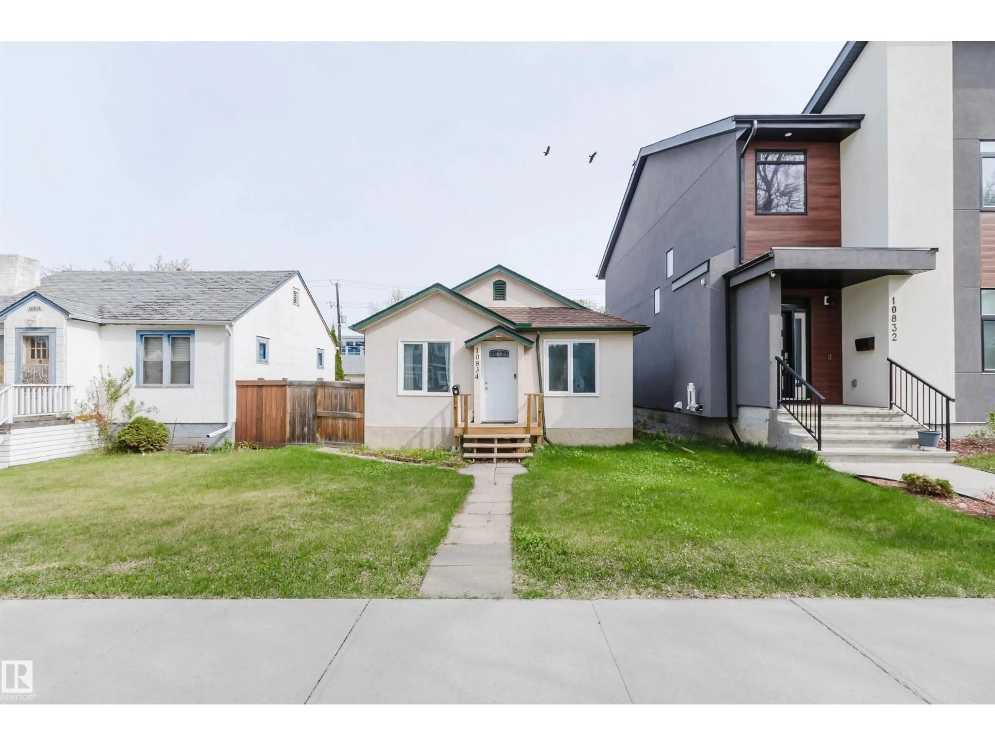 Home with vinyl exterior material, street for 10834 75 AV, Edmonton Alberta T6E1K2