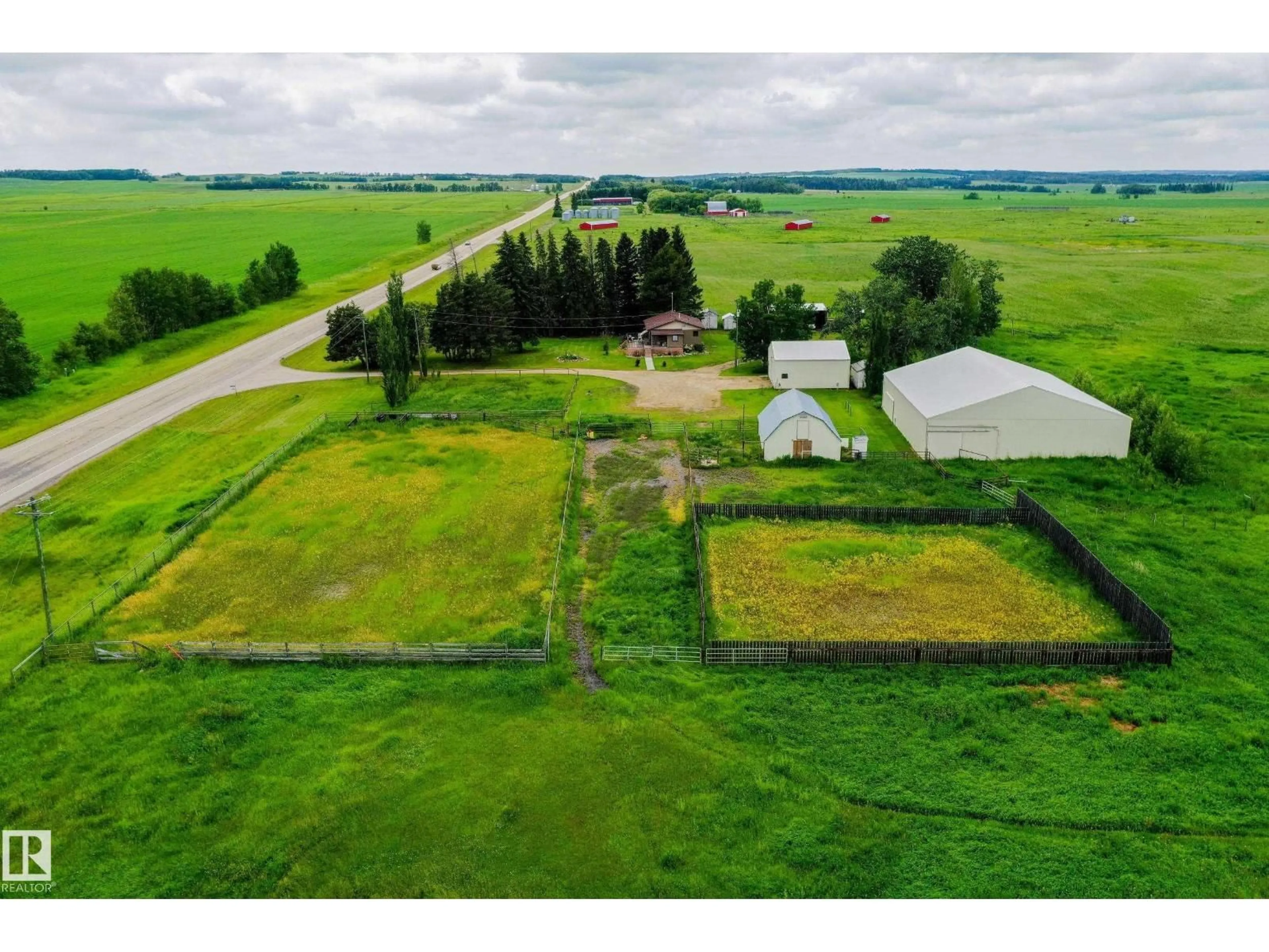 A pic from outside/outdoor area/front of a property/back of a property/a pic from drone, unknown for 280026 HWY 53, Rural Ponoka County Alberta T4J1K3