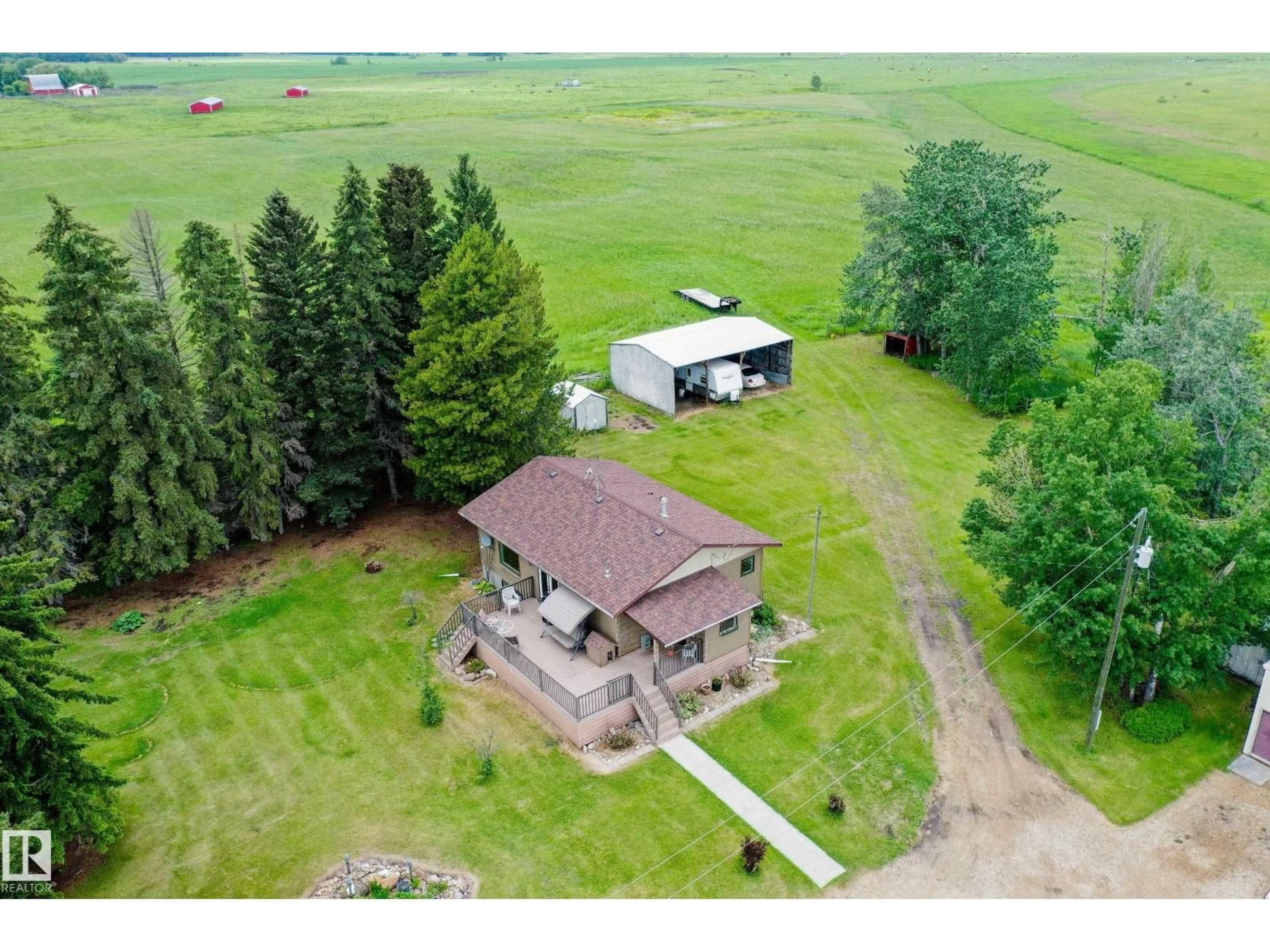 A pic from outside/outdoor area/front of a property/back of a property/a pic from drone, unknown for 280026 HWY 53, Rural Ponoka County Alberta T4J1K3