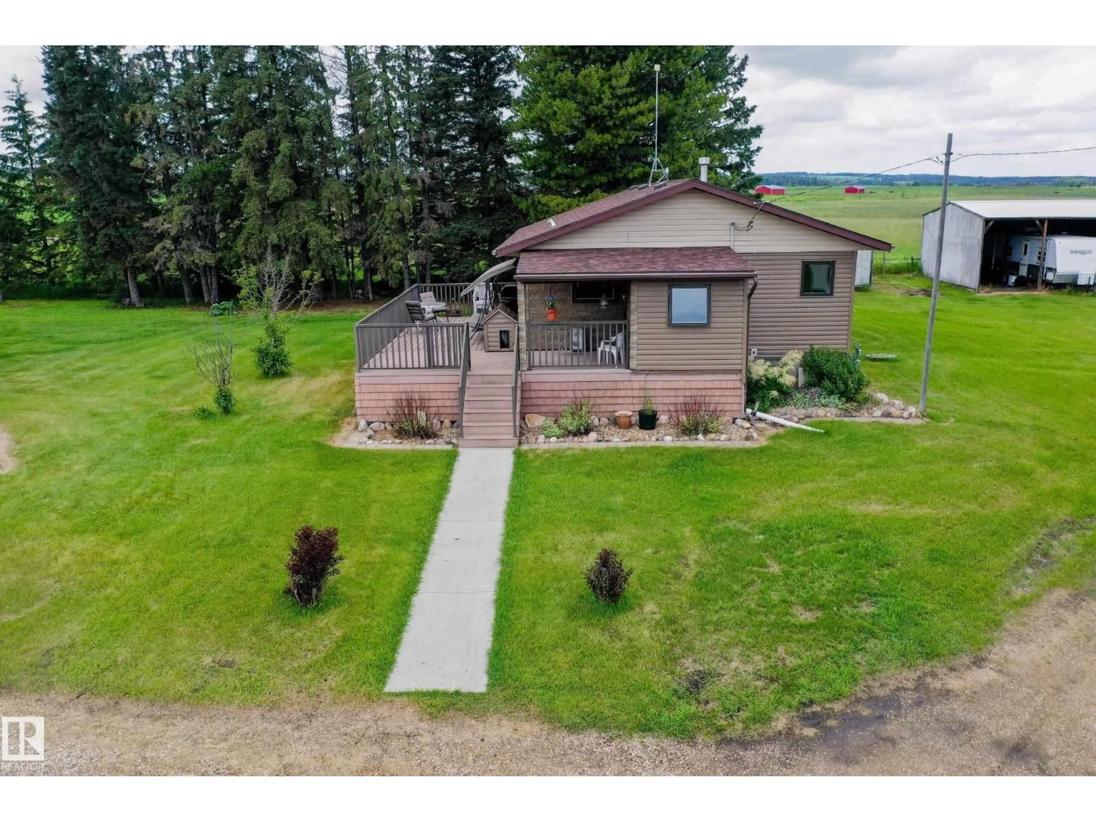 A pic from outside/outdoor area/front of a property/back of a property/a pic from drone, unknown for 280026 HWY 53, Rural Ponoka County Alberta T4J1K3