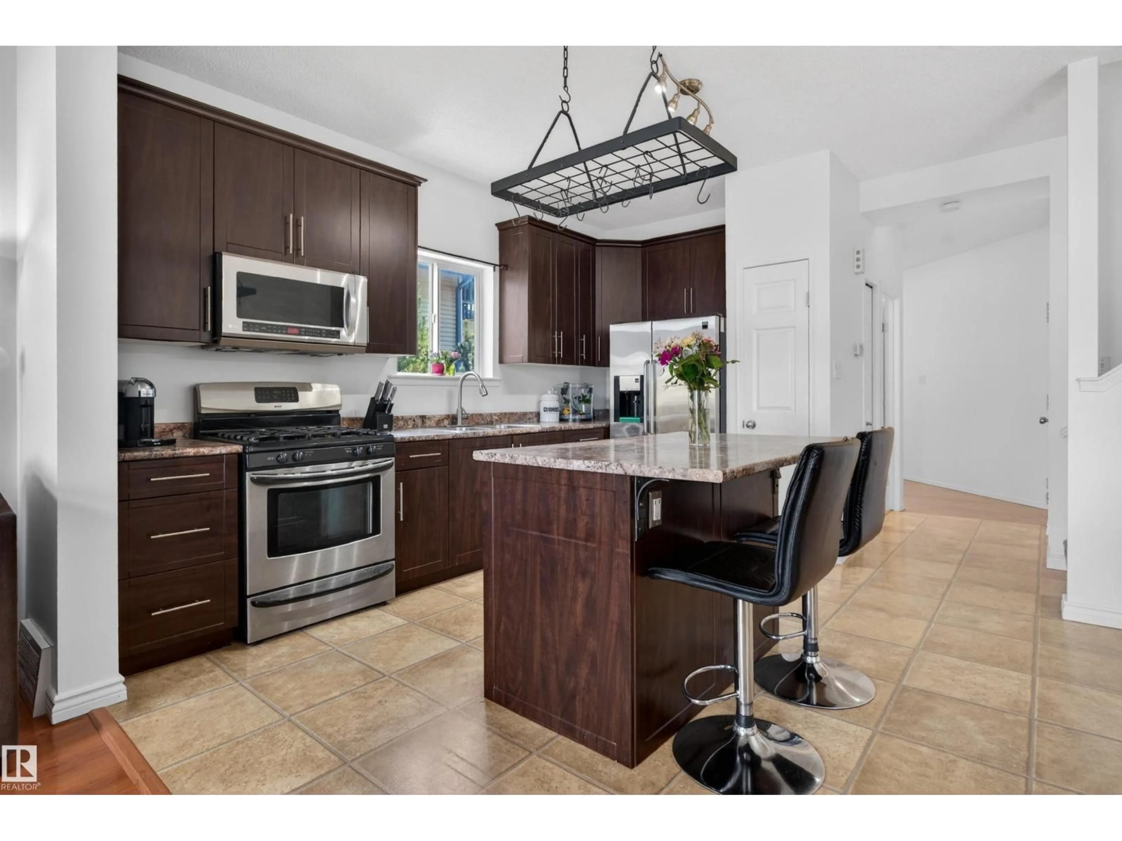 Open concept kitchen, ceramic/tile floor for NW - 9014 166 AV, Edmonton Alberta T5Z3H5