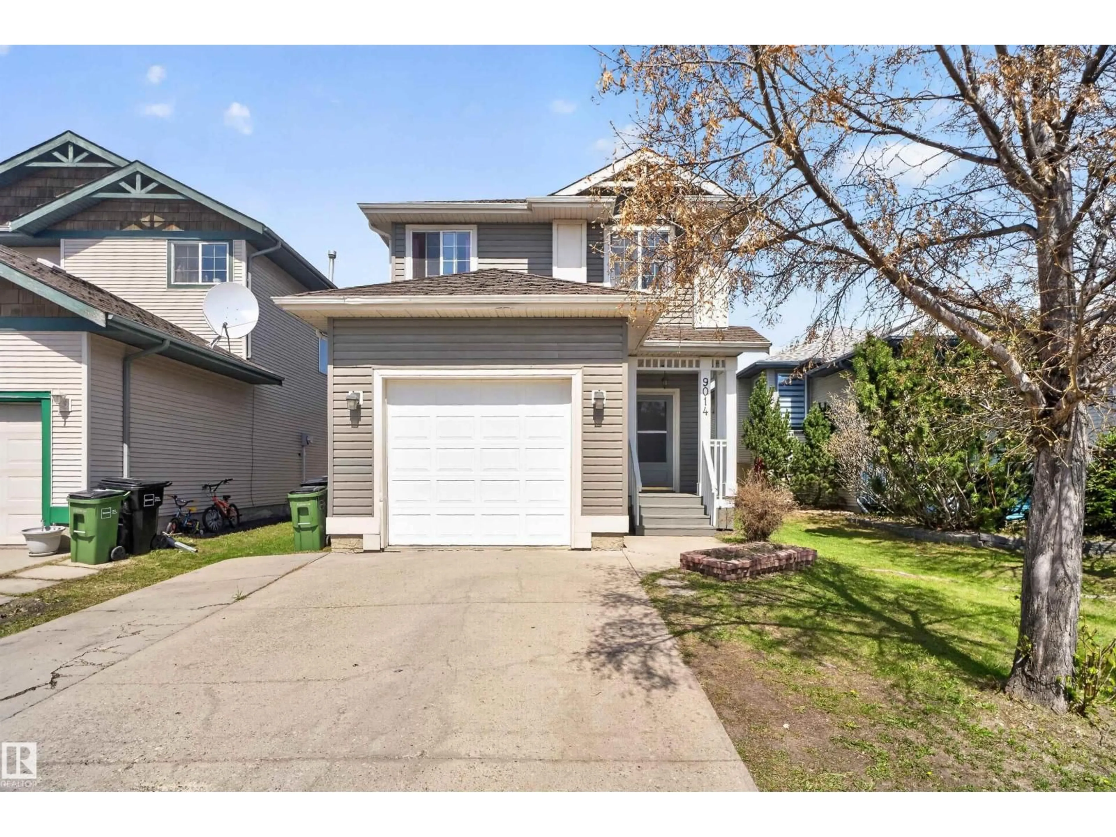 Home with vinyl exterior material, street for NW - 9014 166 AV, Edmonton Alberta T5Z3H5