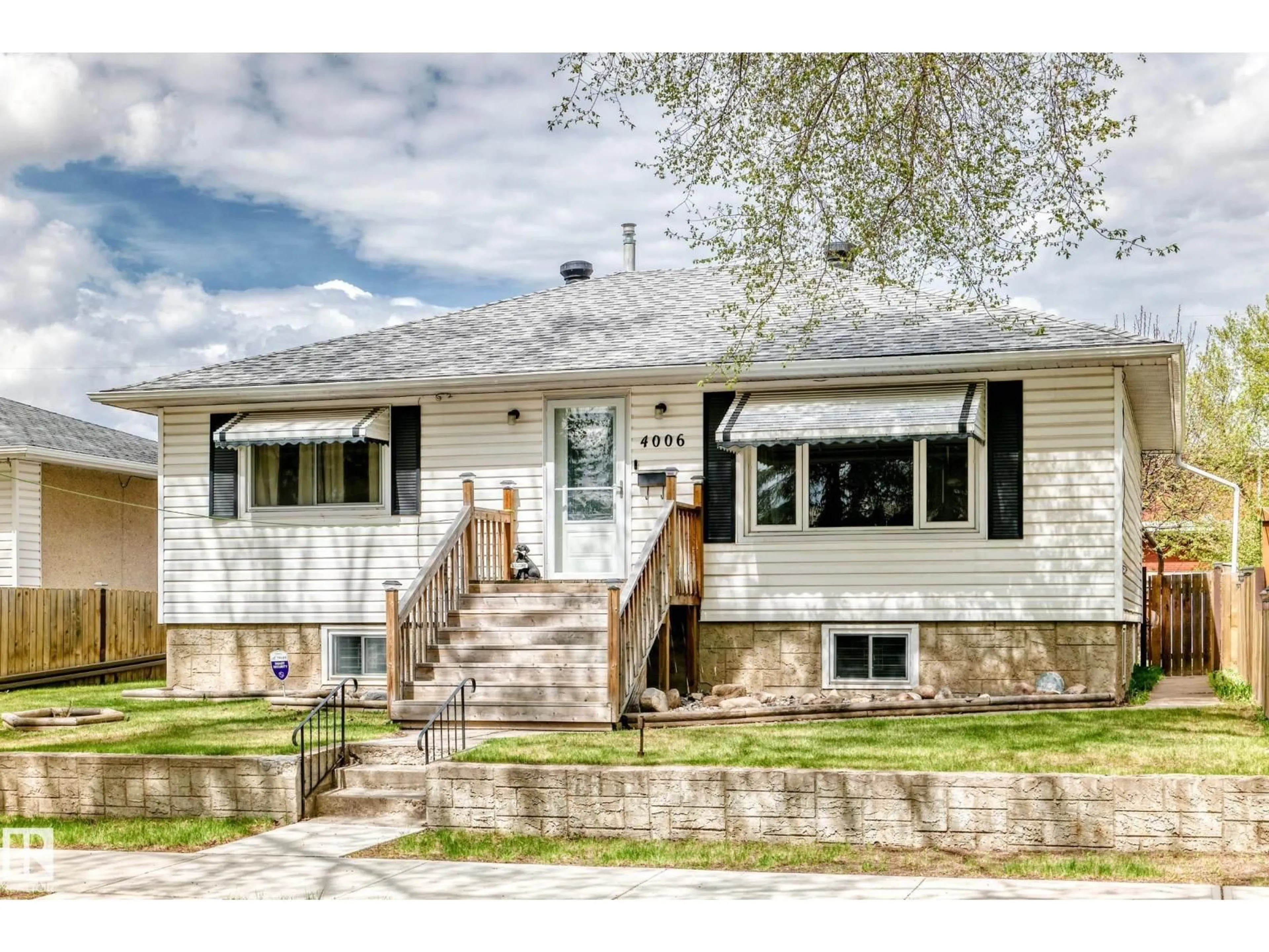 Home with vinyl exterior material, street for NW - 4006 115 AV, Edmonton Alberta T5W0V4