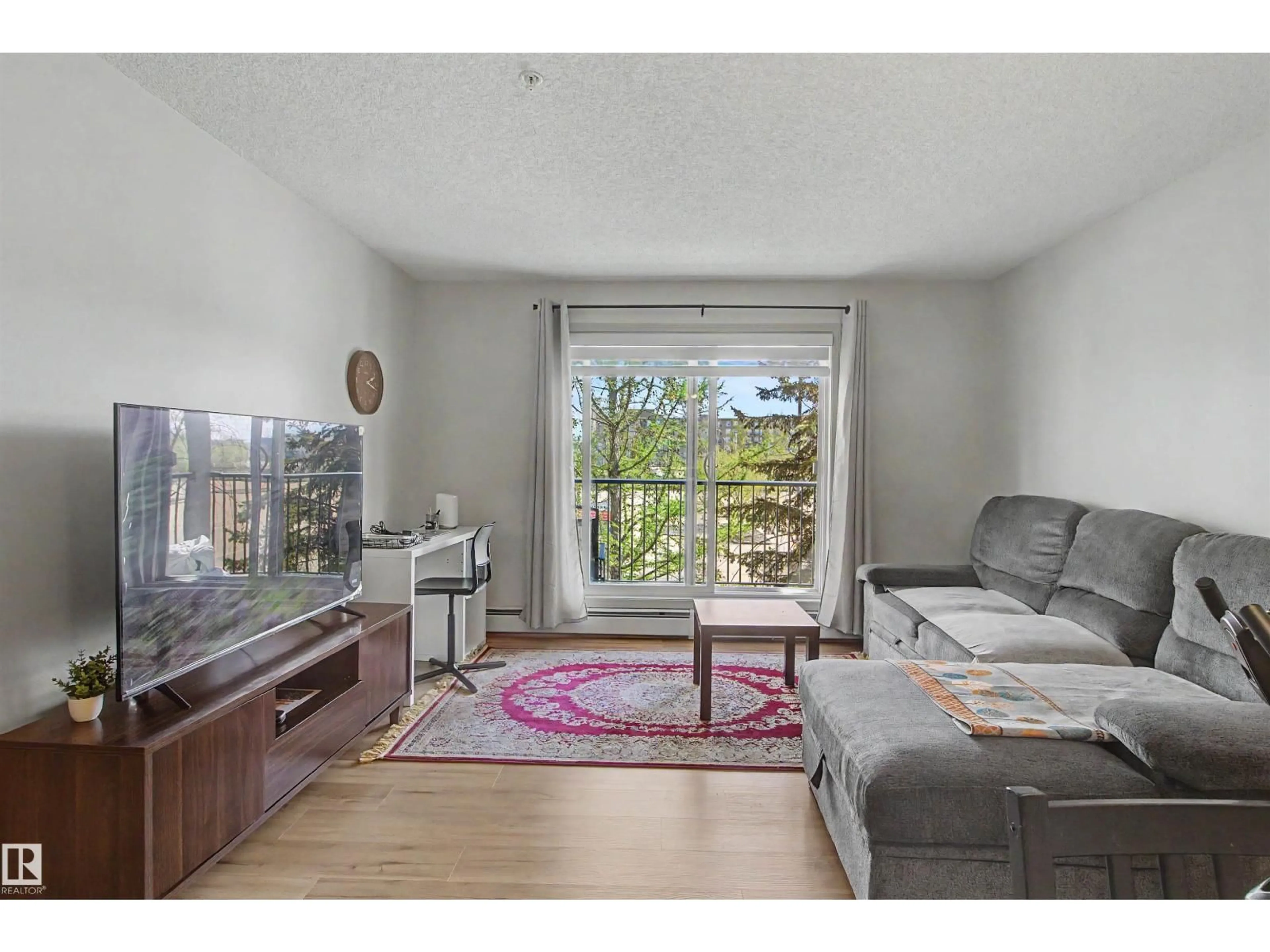 Living room with furniture, unknown for #204 - 309 CLAREVIEW STATION DR, Edmonton Alberta T5Y0C5