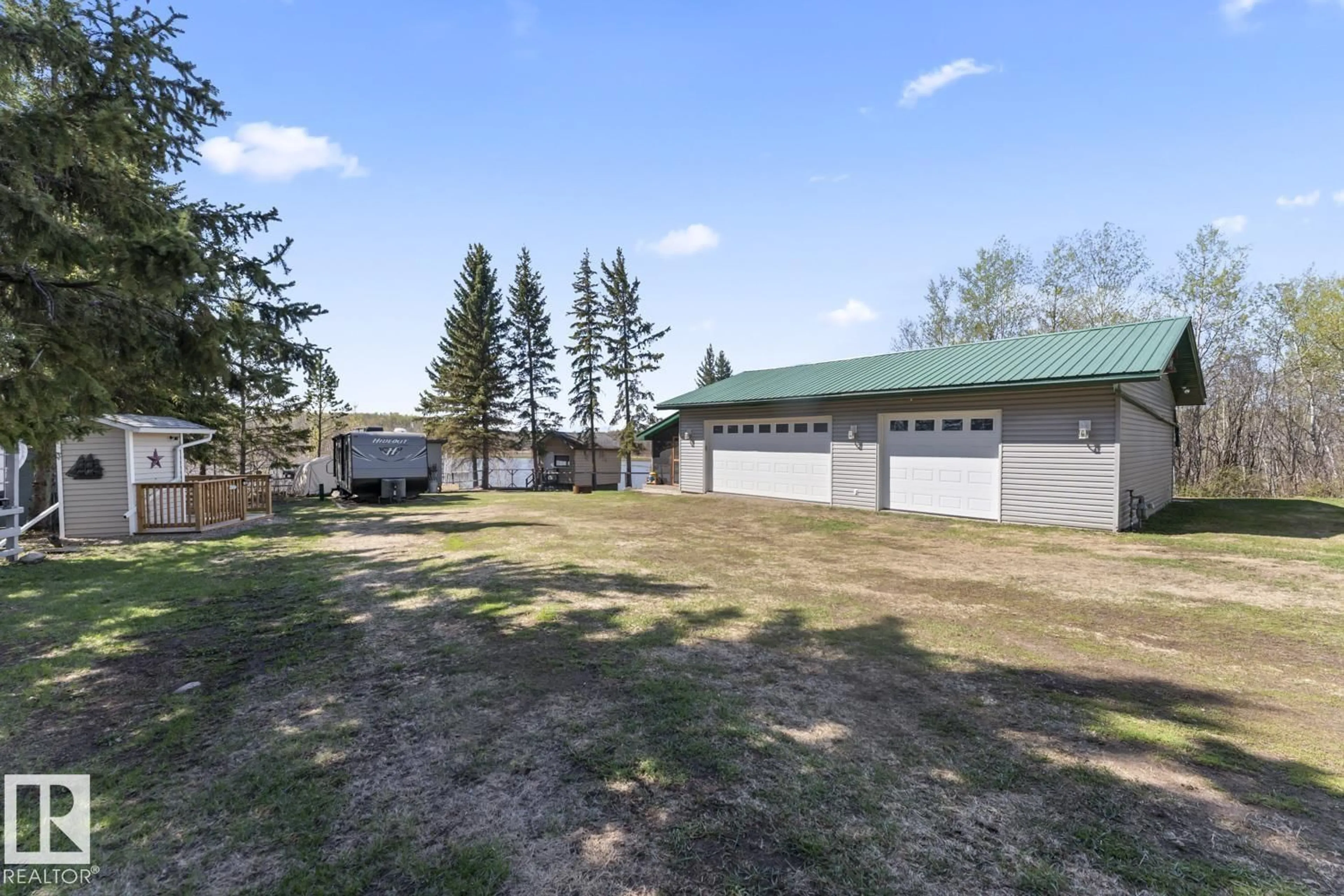 A pic from outside/outdoor area/front of a property/back of a property/a pic from drone, unknown for 705 - 11025 HGHWAY 28, Rural St. Paul County Alberta T0A0C0