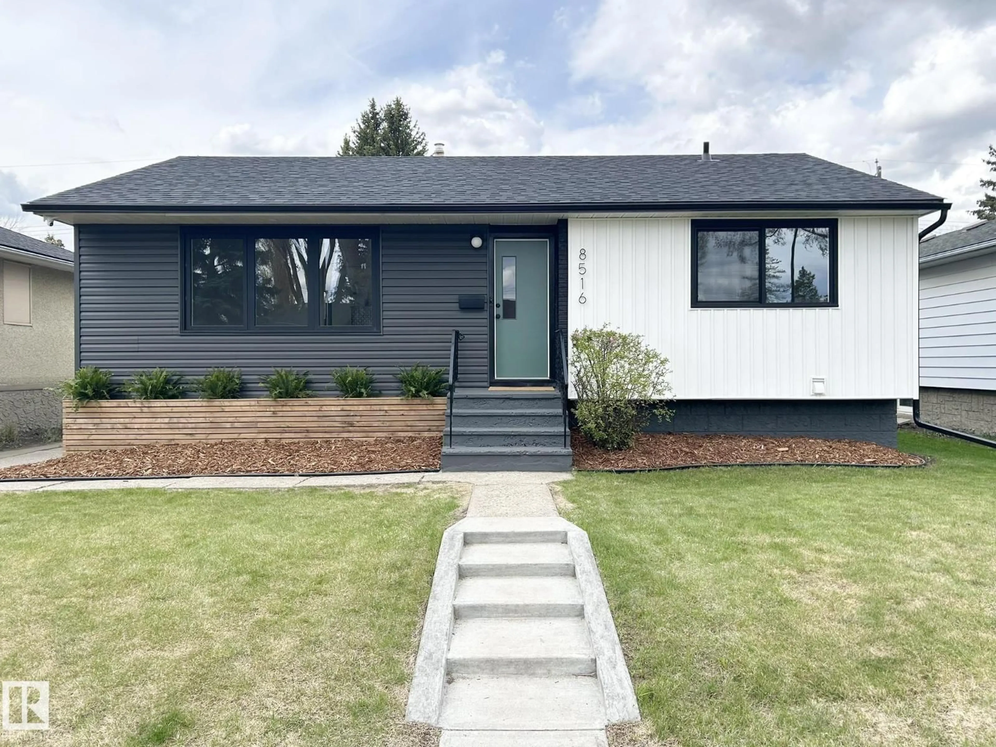 Home with vinyl exterior material, street for 8516 64 AV, Edmonton Alberta T6E0H3