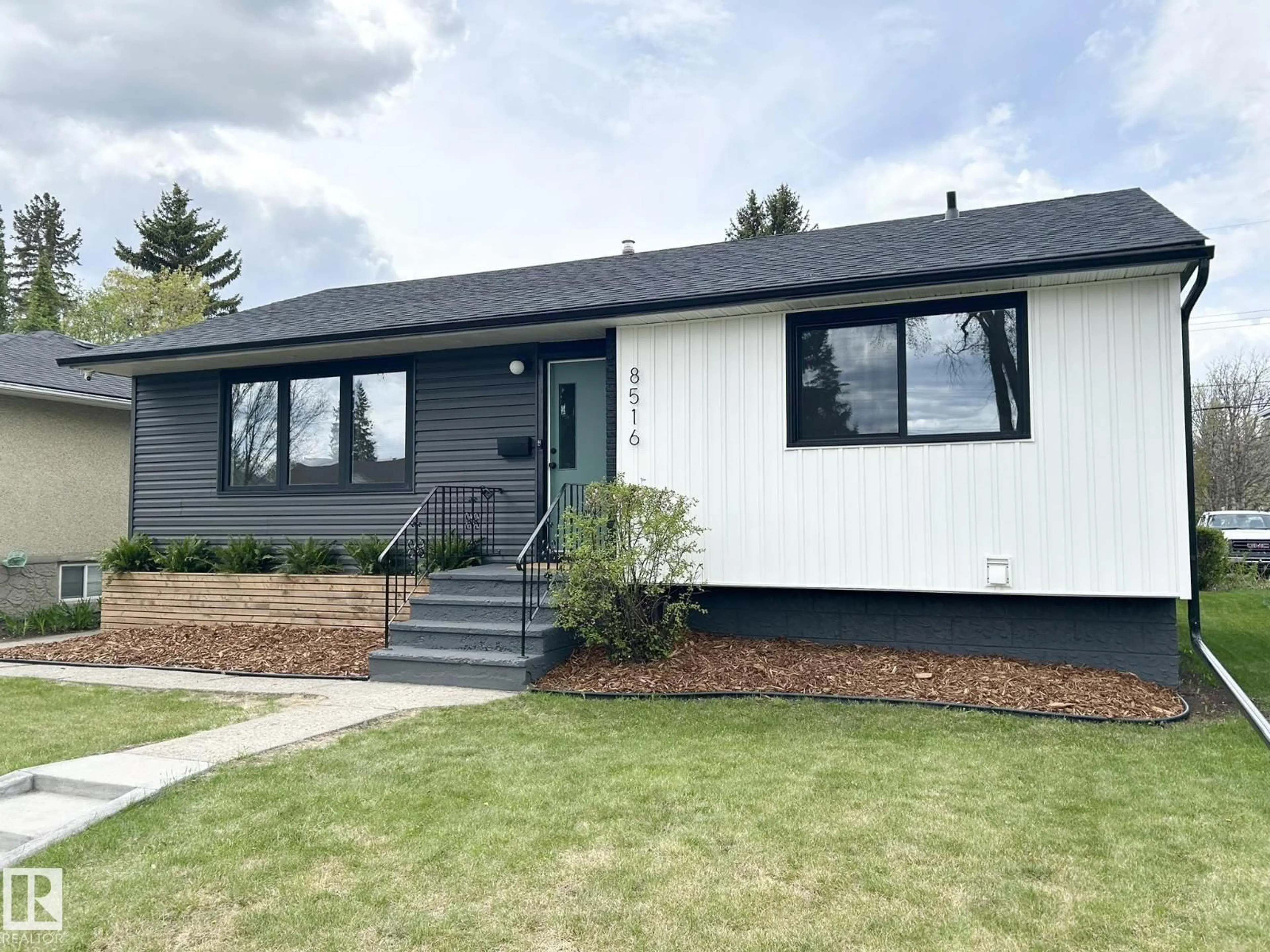 Home with vinyl exterior material, street for 8516 64 AV, Edmonton Alberta T6E0H3