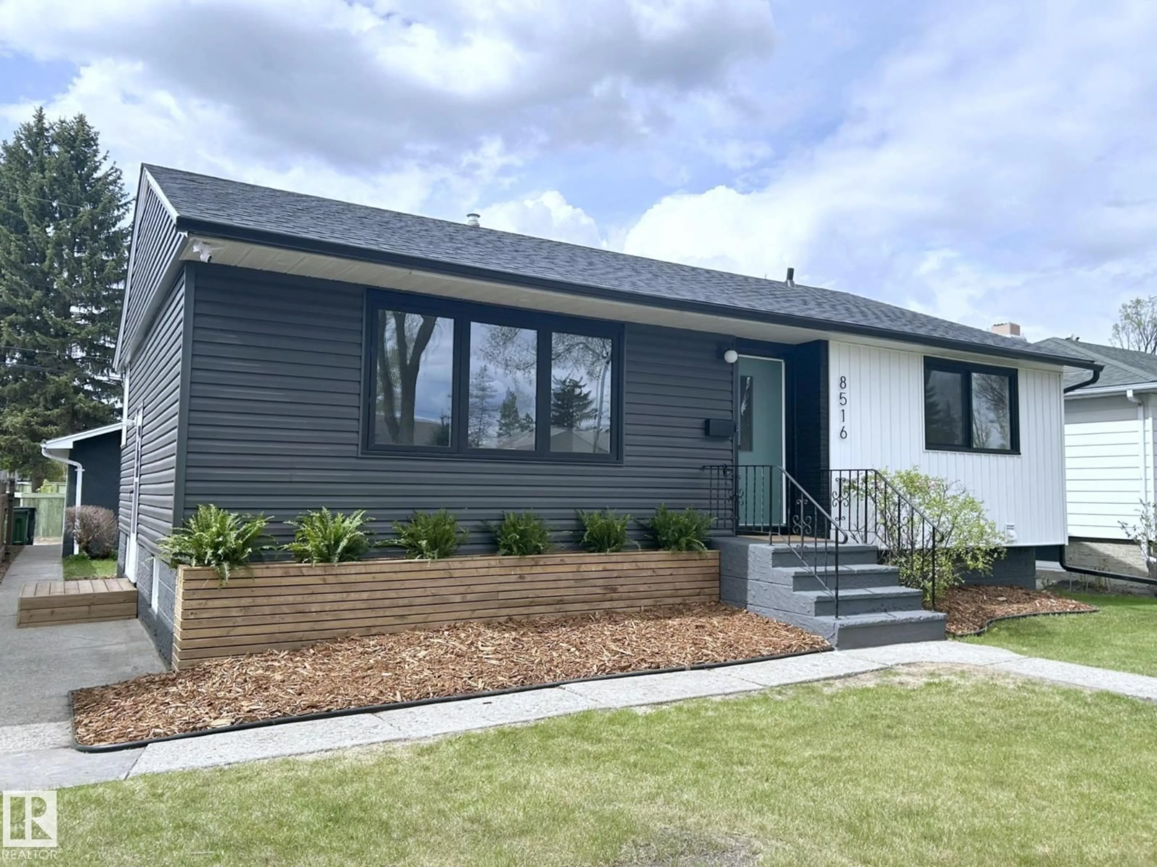 Home with vinyl exterior material, street for 8516 64 AV, Edmonton Alberta T6E0H3