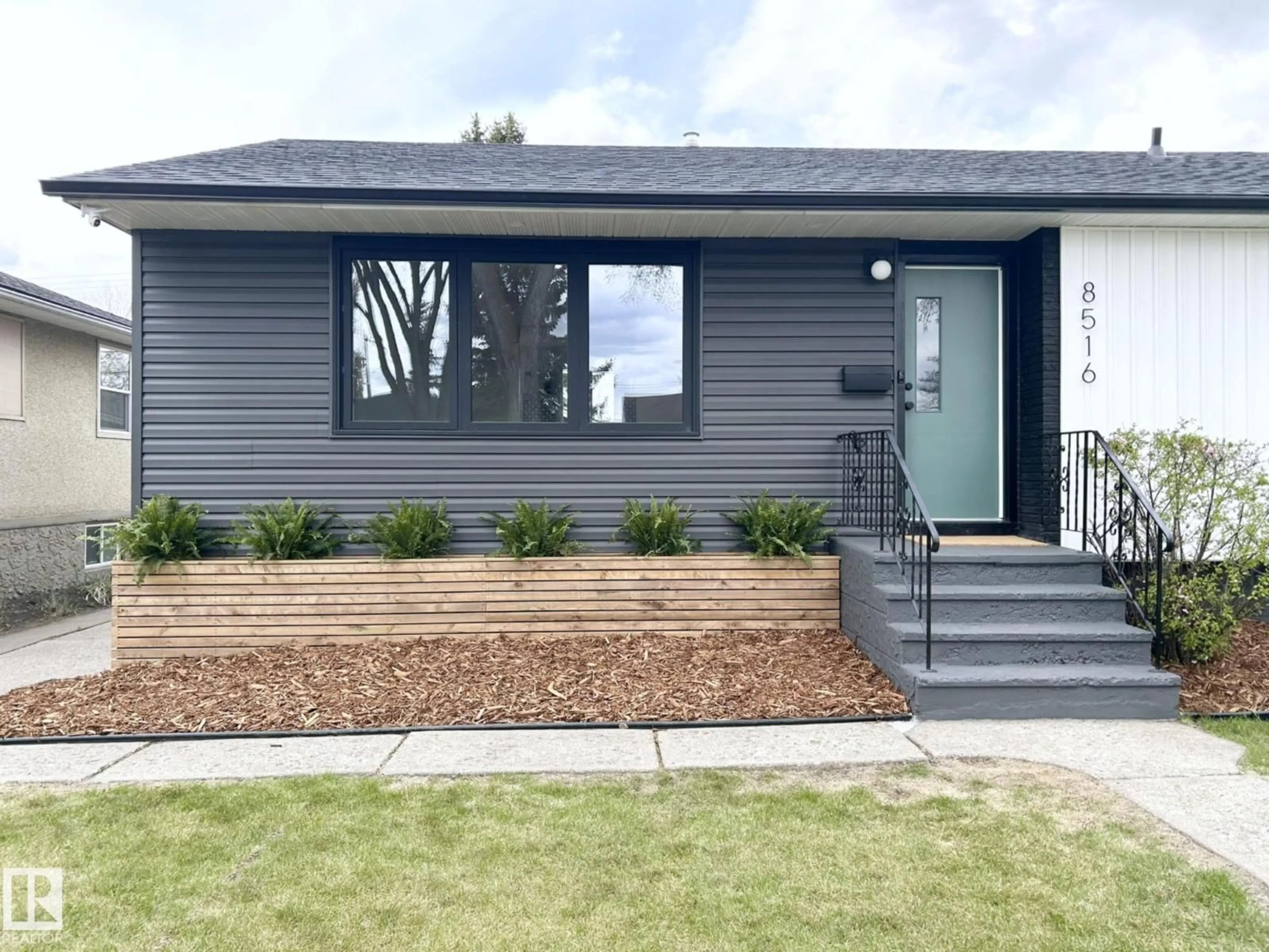 Home with vinyl exterior material, street for 8516 64 AV, Edmonton Alberta T6E0H3