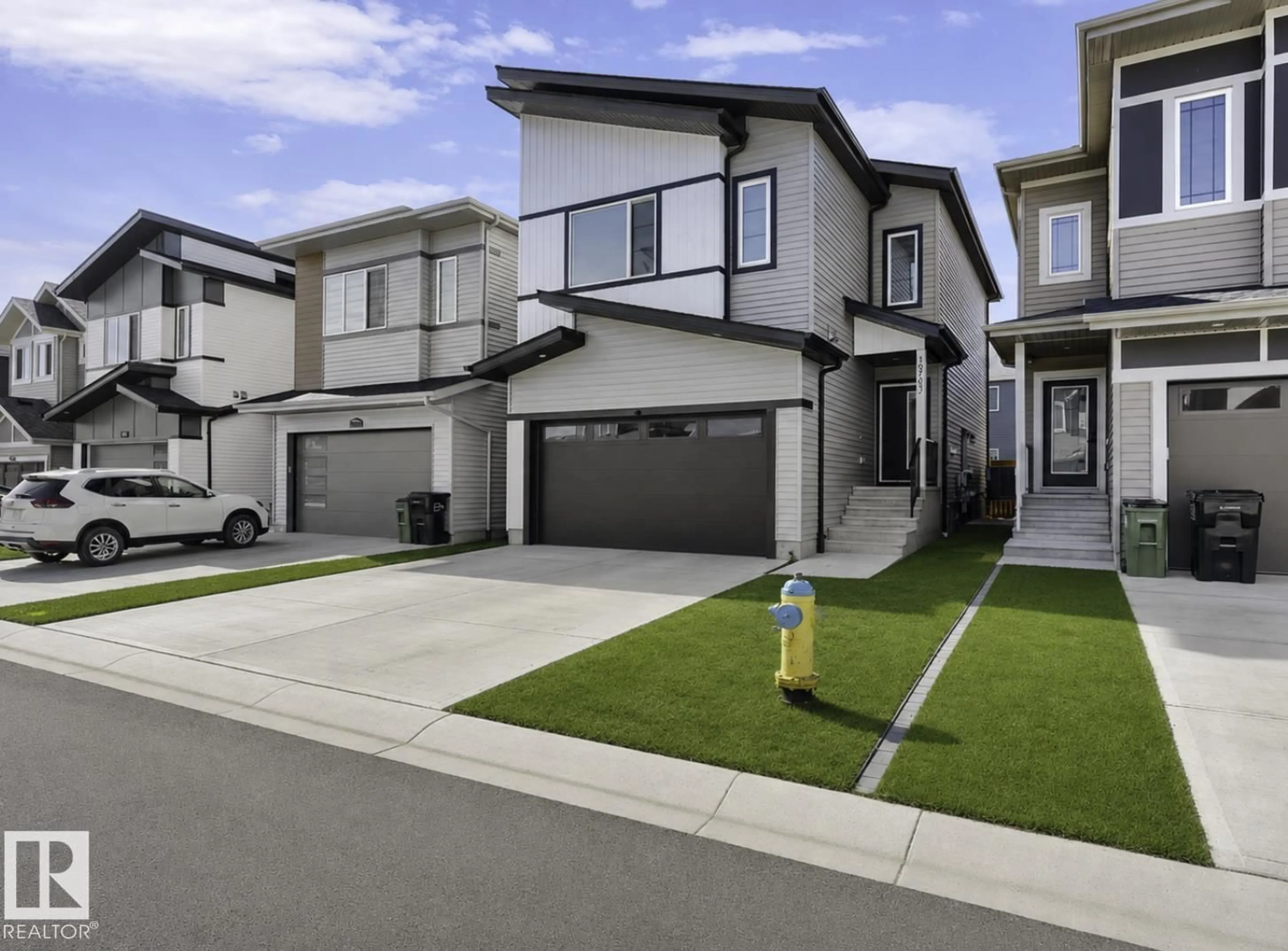 Home with vinyl exterior material, street for 19703 29 AVENUE, Edmonton Alberta T6M1M2