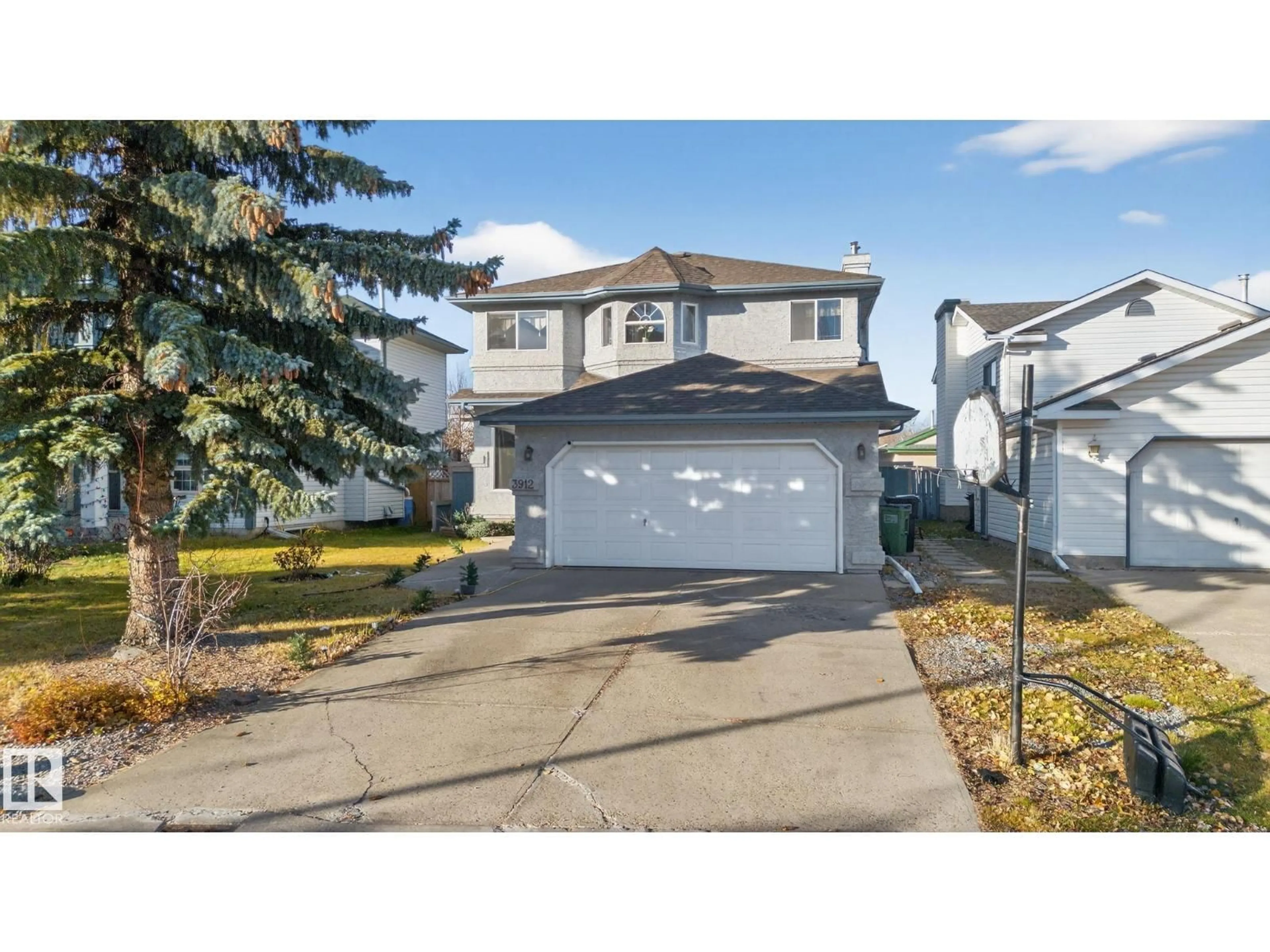 Home with vinyl exterior material, street for 3912 31 ST, Edmonton Alberta T6T1J5