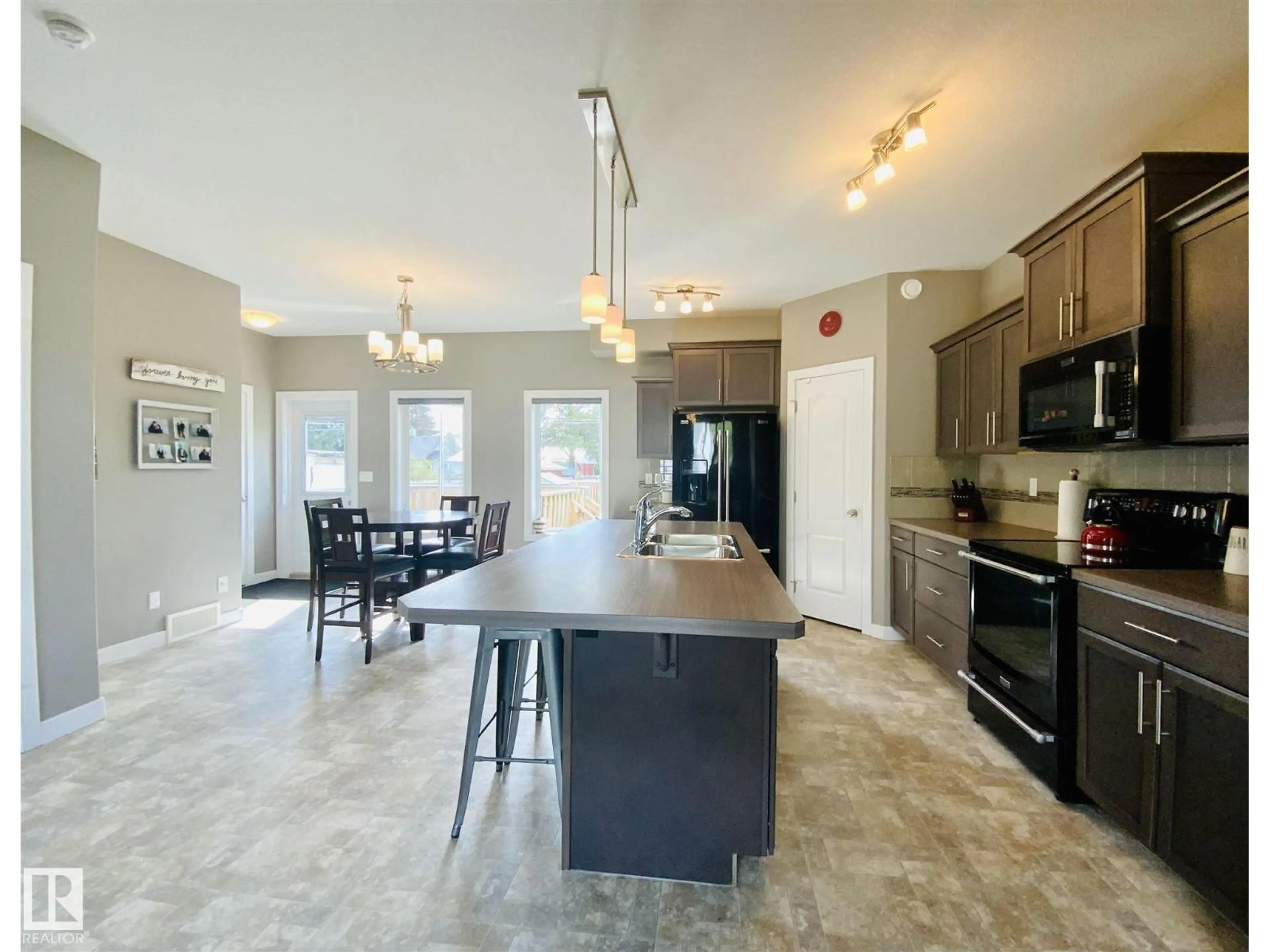 Open concept kitchen, ceramic/tile floor for 4506 53 ST, Wetaskiwin Alberta T9A1R3