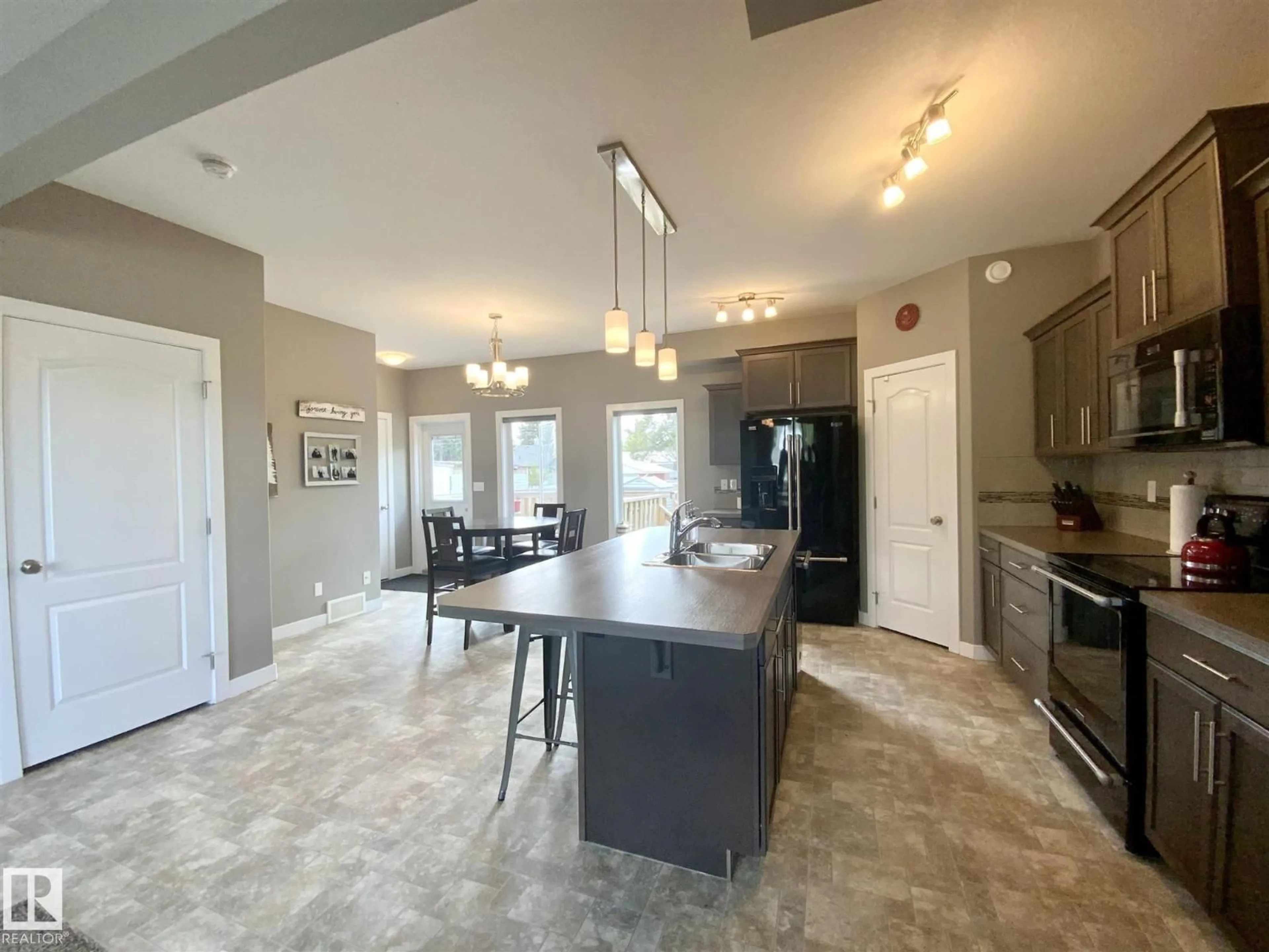 Open concept kitchen, ceramic/tile floor for 4506 53 ST, Wetaskiwin Alberta T9A1R3