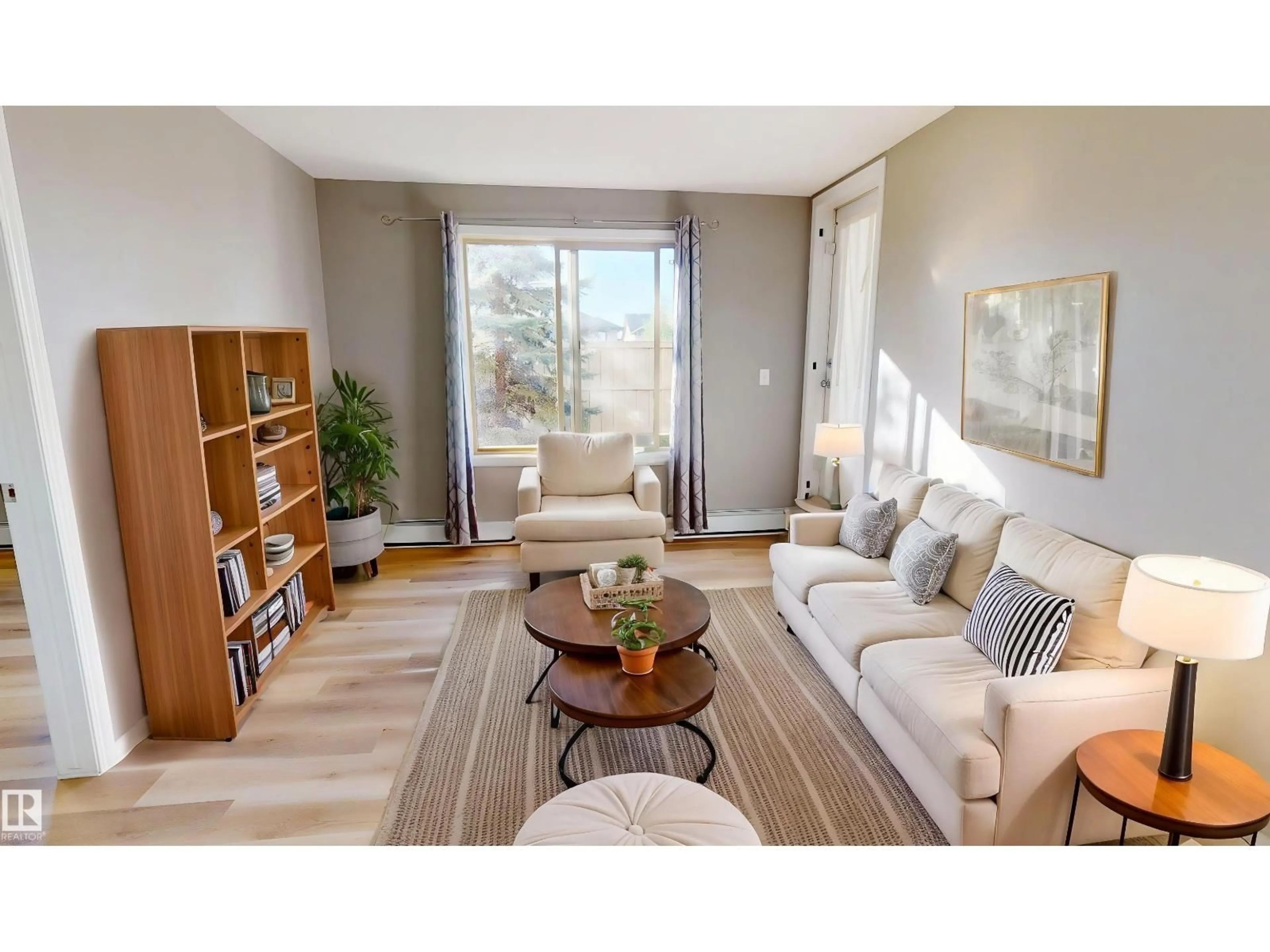 Living room with furniture, wood/laminate floor for #116 - 11808 22 AV, Edmonton Alberta T6W2A2
