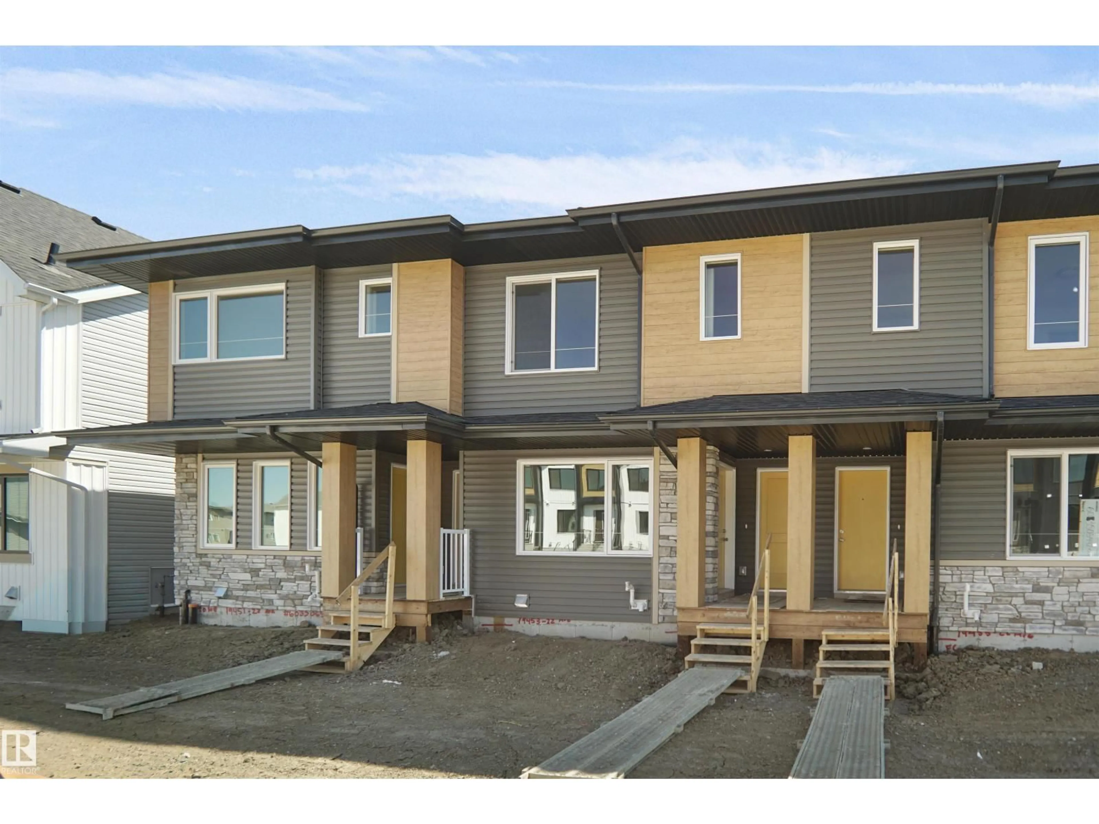 Home with vinyl exterior material, street for 19453 22 AV, Edmonton Alberta T6M3J3