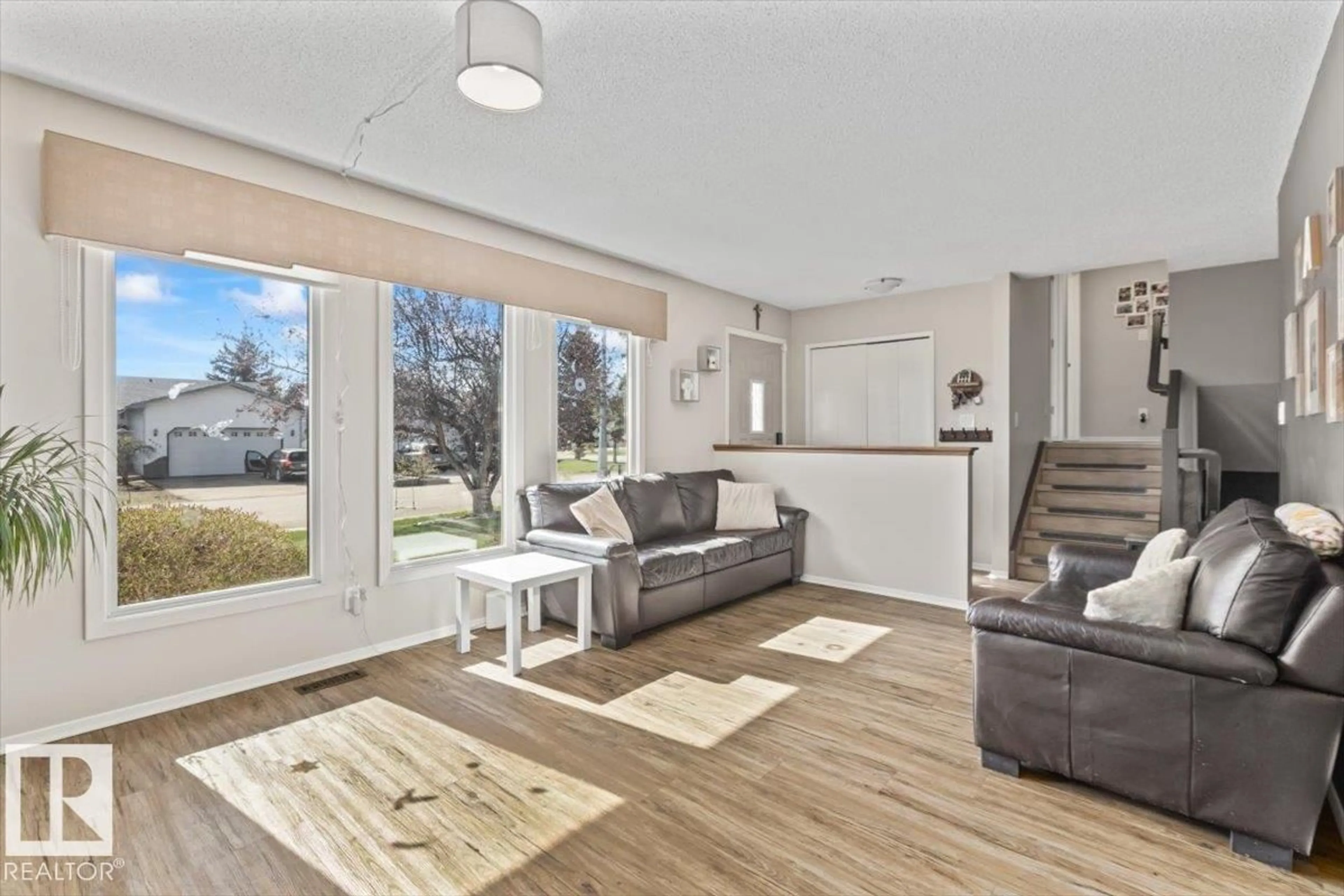 Living room with furniture, wood/laminate floor for 9504 96 ST, Morinville Alberta T8R1H8
