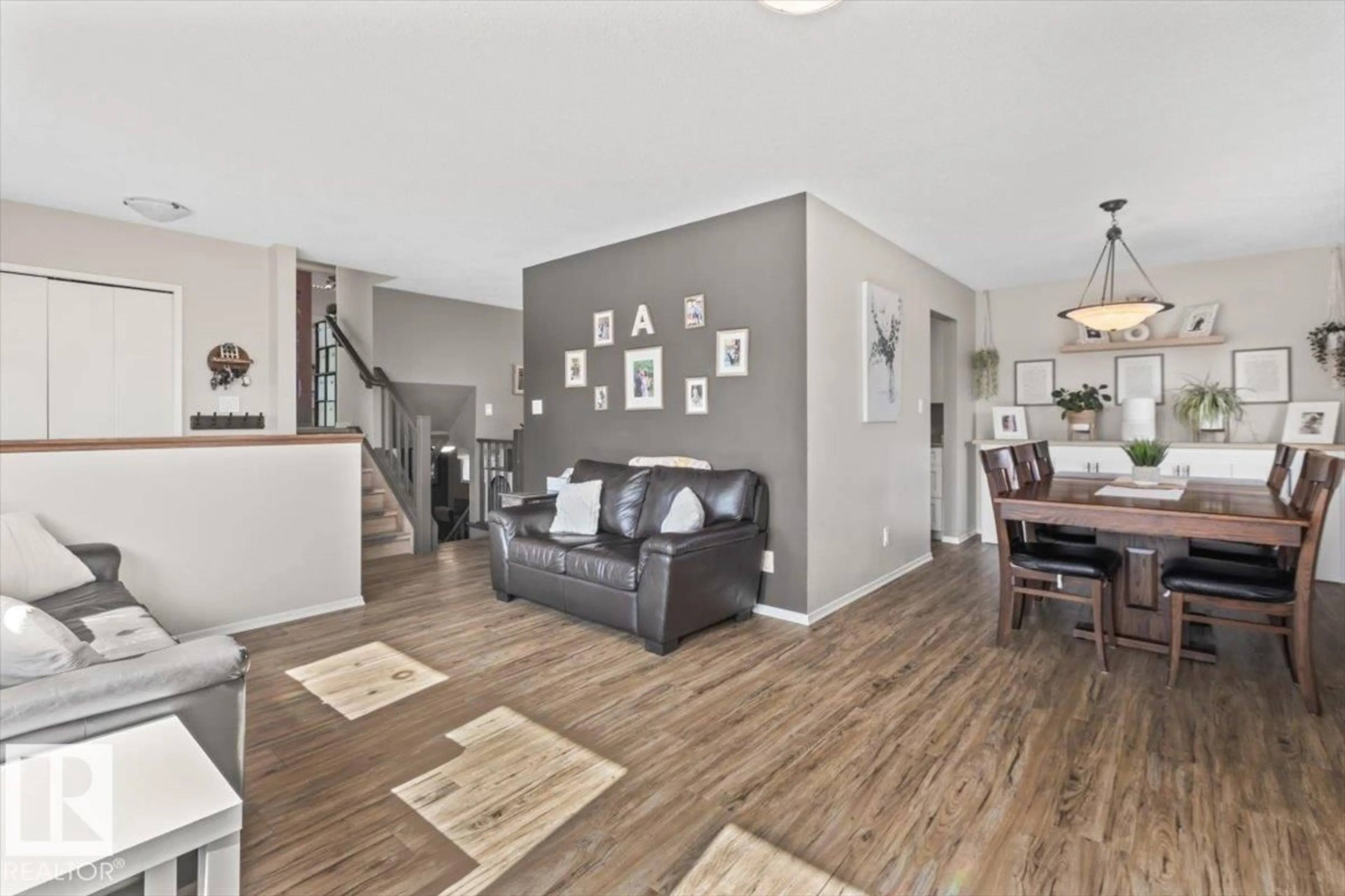 Living room with furniture, wood/laminate floor for 9504 96 ST, Morinville Alberta T8R1H8