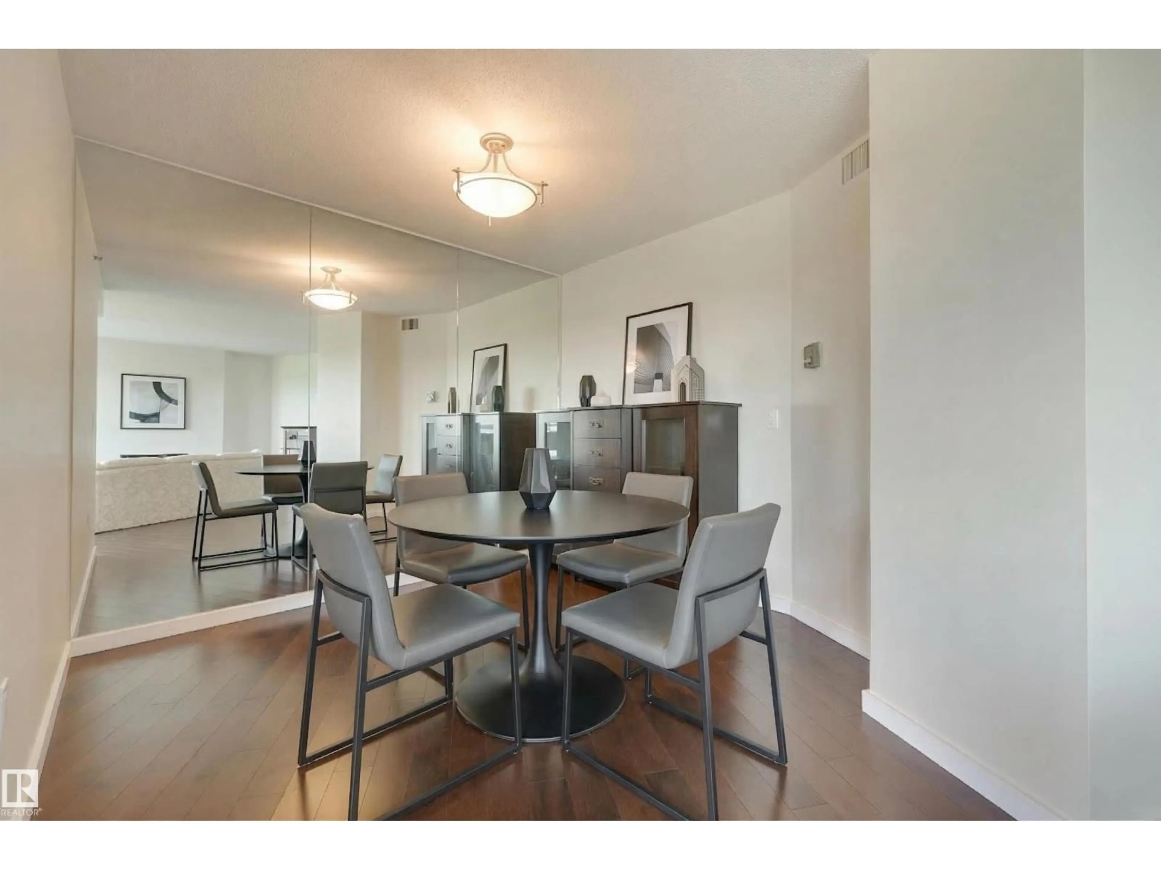 Dining room, wood/laminate floor for #1003 - 12319 JASPER AV, Edmonton Alberta T5N4A7