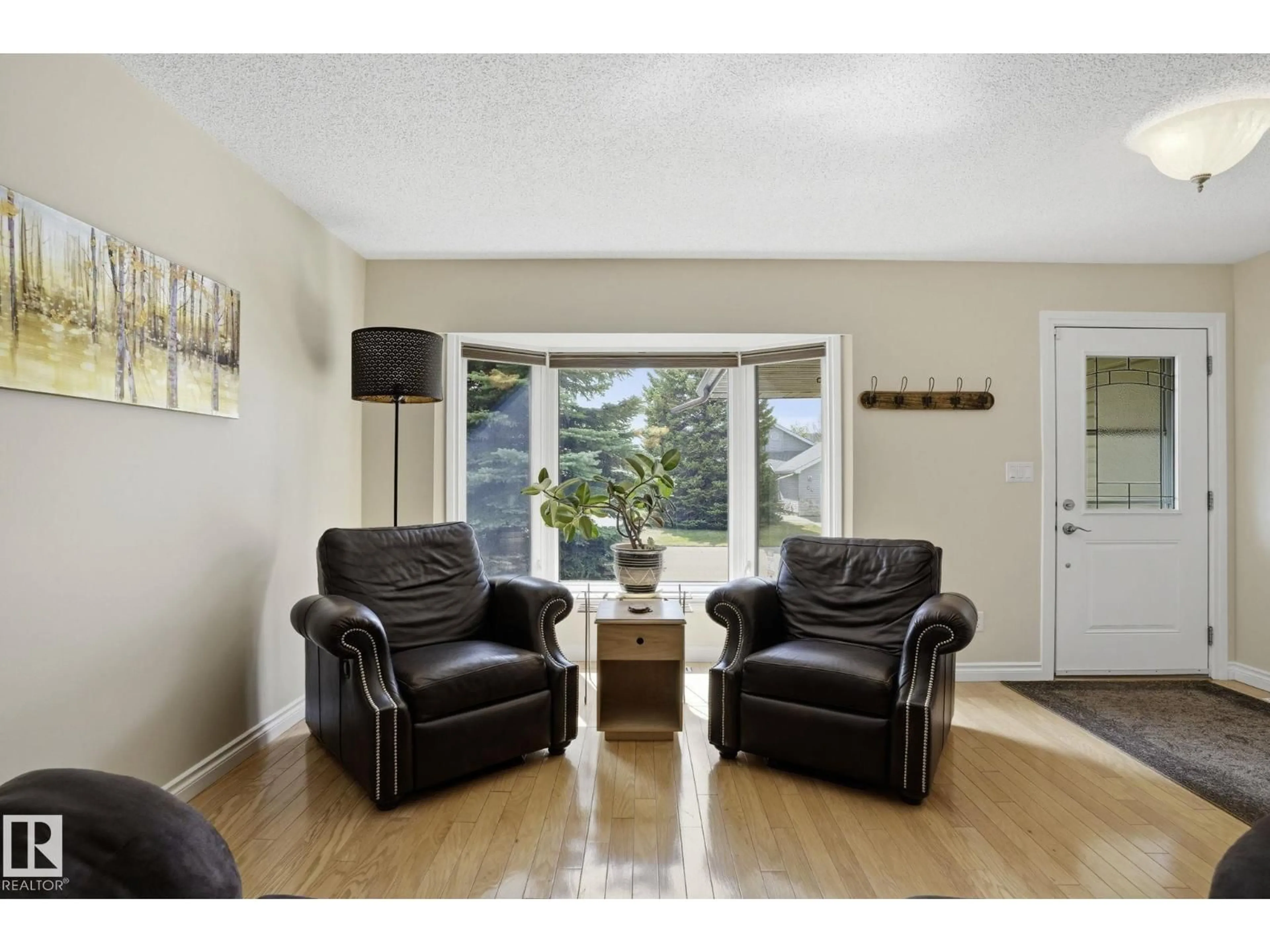 Living room with furniture, wood/laminate floor for 44 MOREL DR, Spruce Grove Alberta T7X5P9