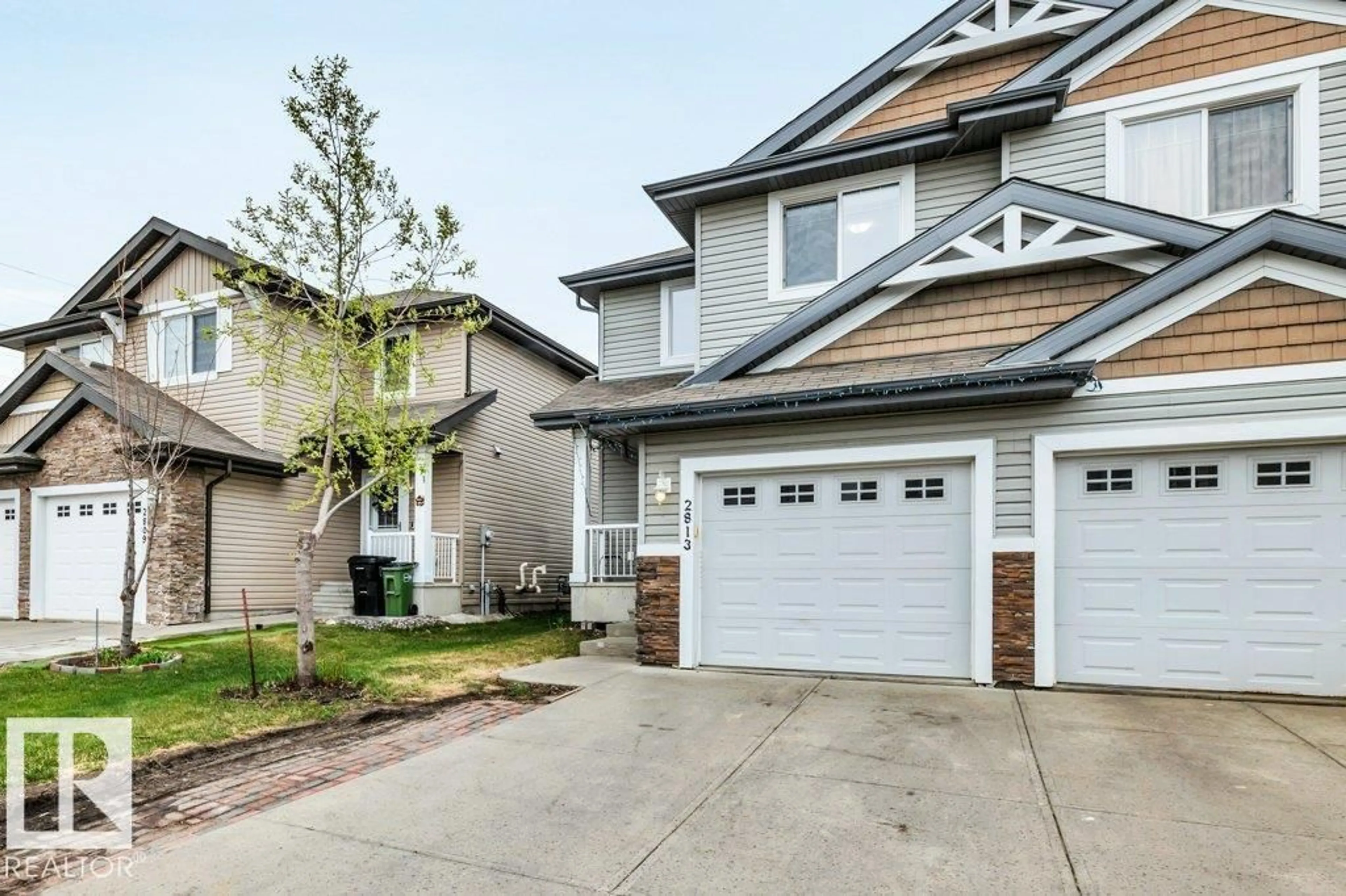 Home with vinyl exterior material, street for 2813 18A AV, Edmonton Alberta T6T0N8