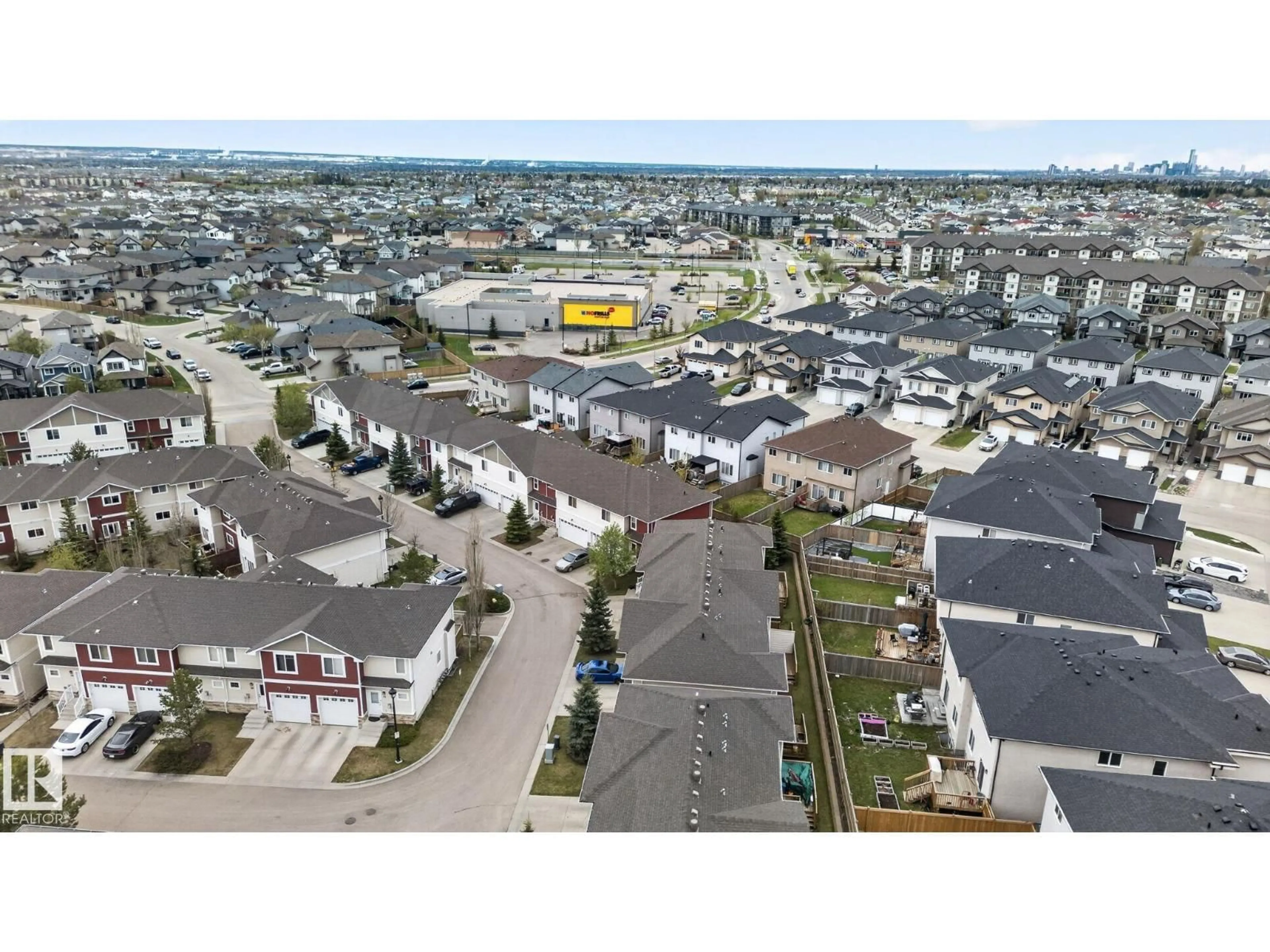 A pic from outside/outdoor area/front of a property/back of a property/a pic from drone, street for #11 - 450 MCCONACHIE WY, Edmonton Alberta T5Y0S8