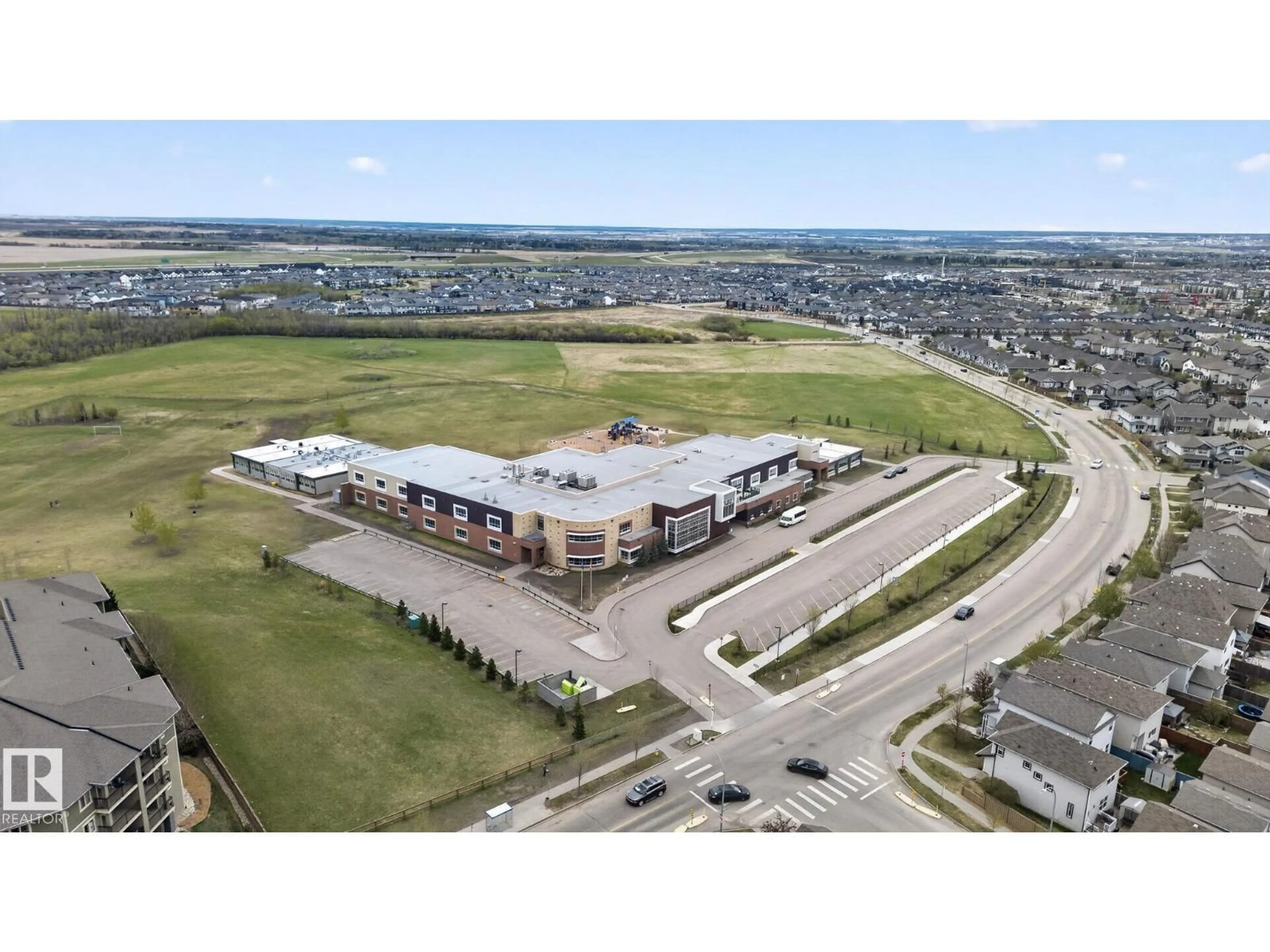 A pic from outside/outdoor area/front of a property/back of a property/a pic from drone, building for #11 - 450 MCCONACHIE WY, Edmonton Alberta T5Y0S8