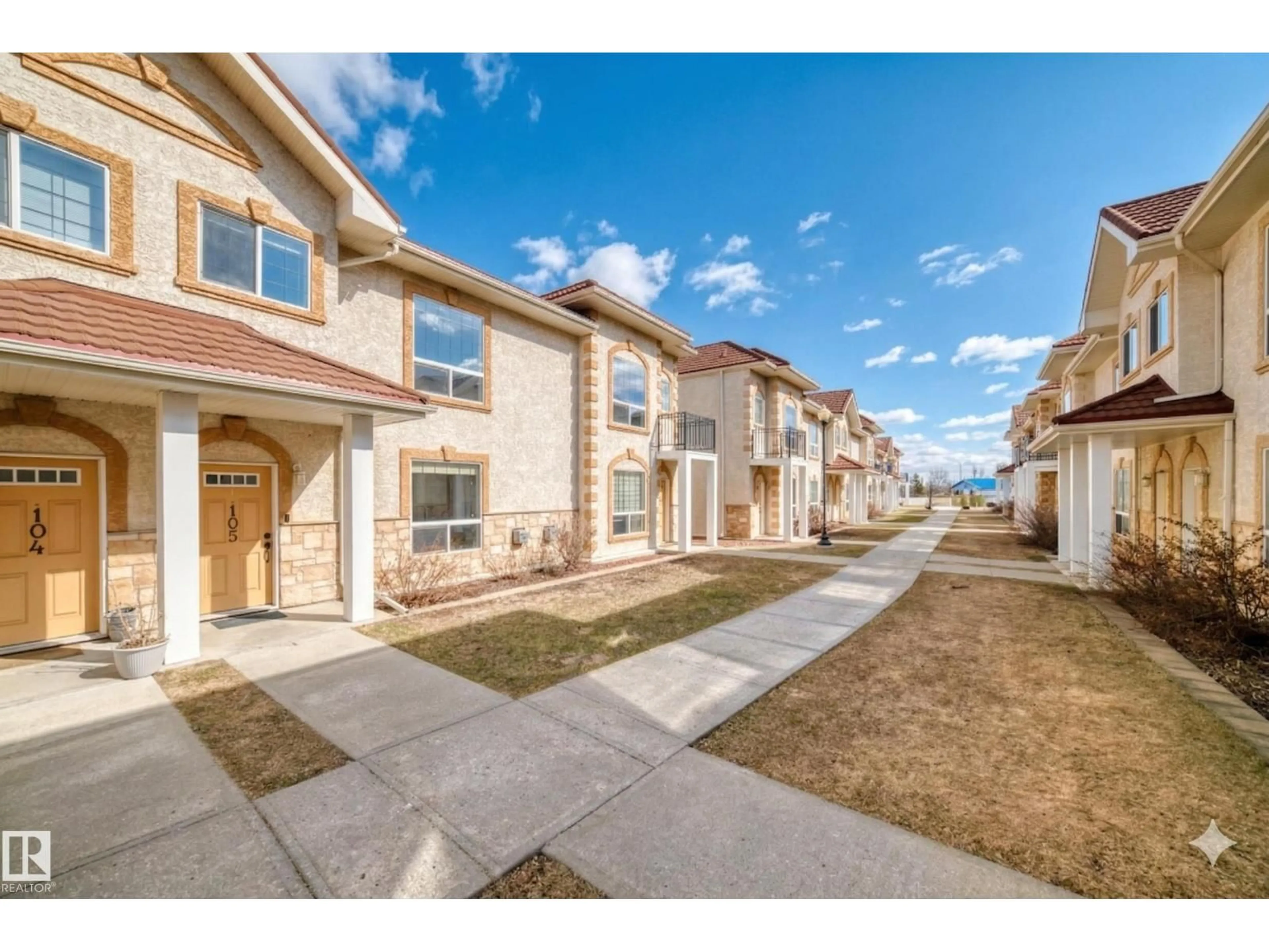 A pic from outside/outdoor area/front of a property/back of a property/a pic from drone, street for 105 - 13825 155 AV NW, Edmonton Alberta T6V0B8