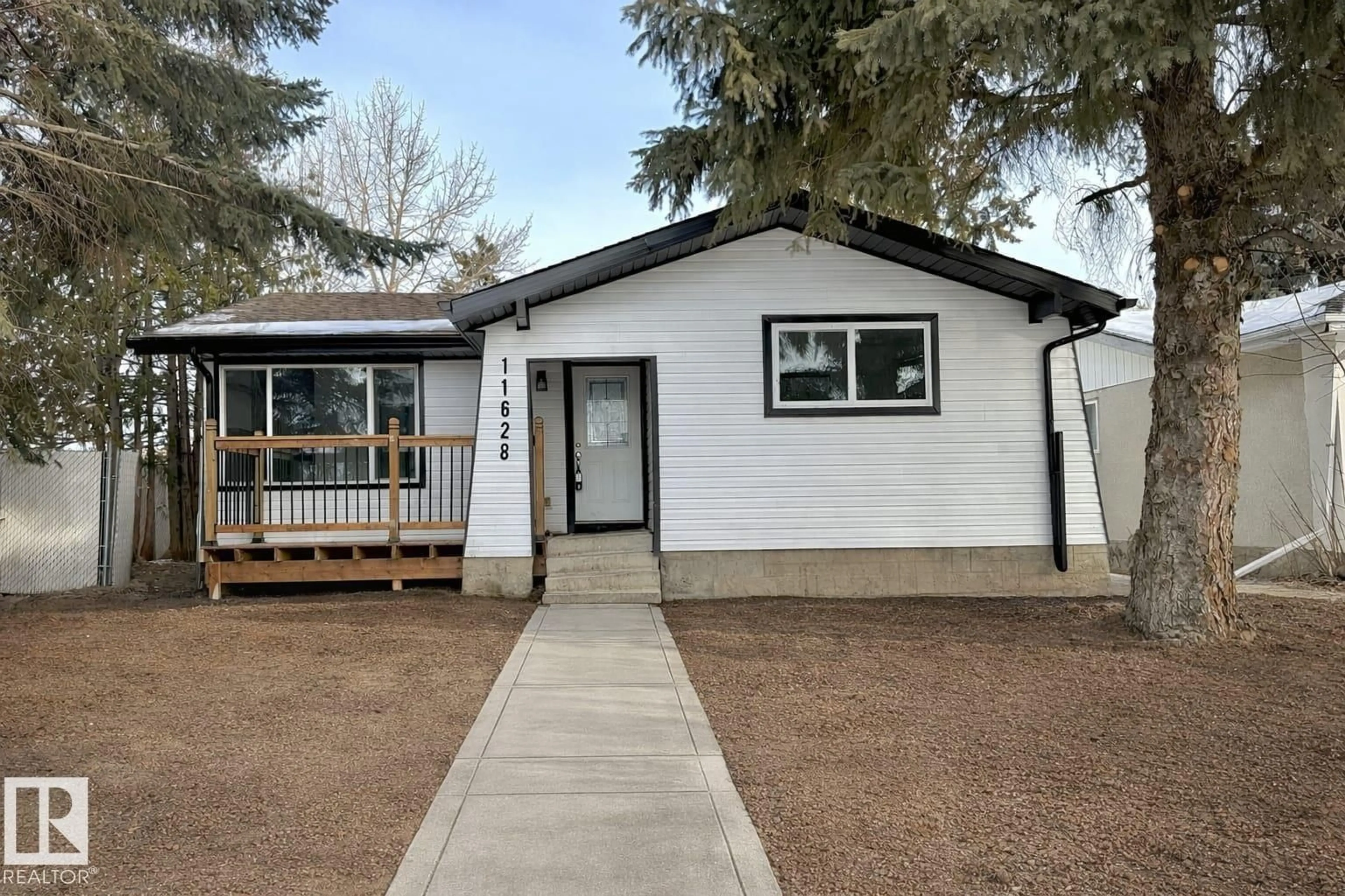 Home with vinyl exterior material, street for 11628 151 AV, Edmonton Alberta T5X1C6