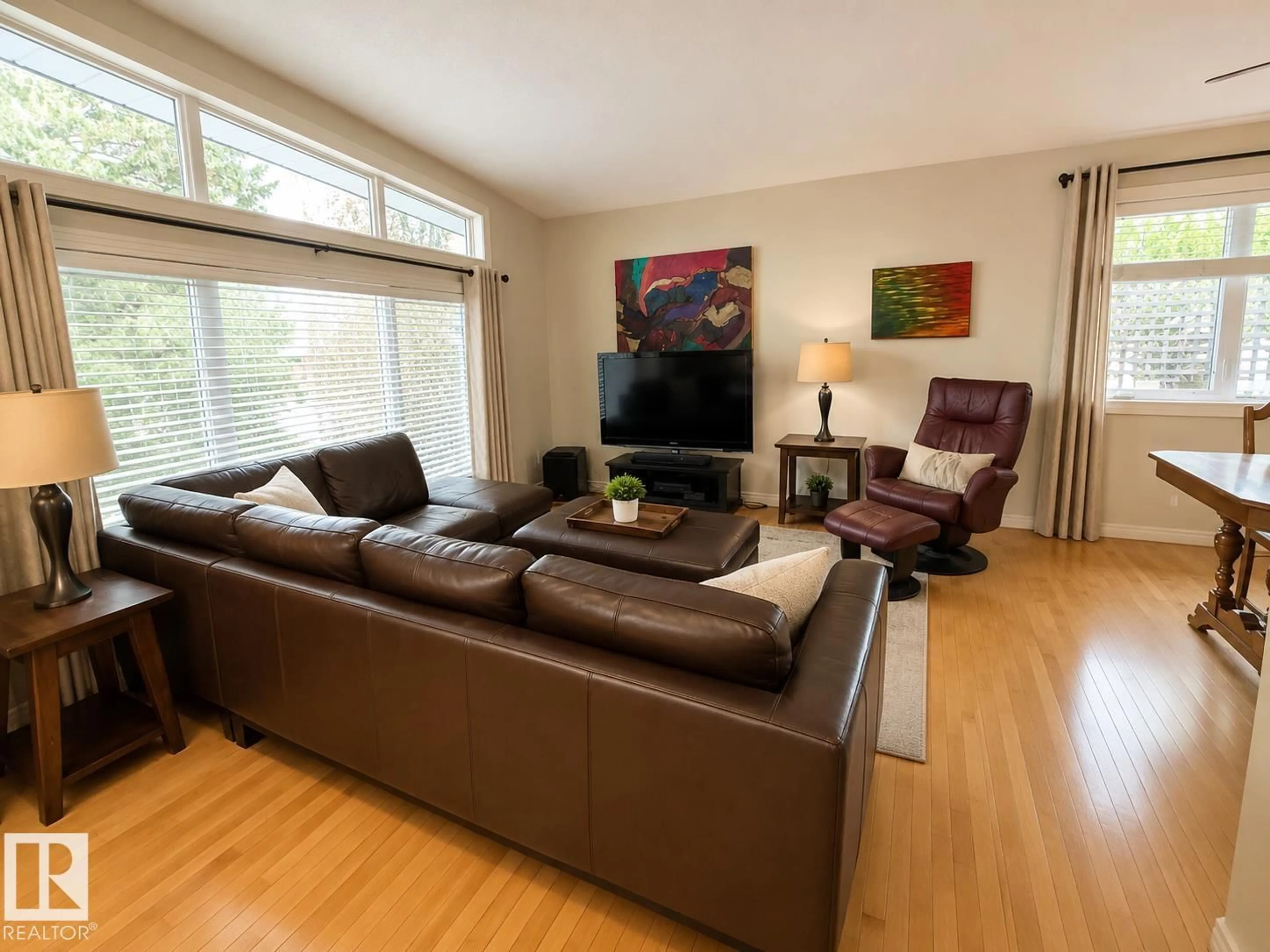 Living room with furniture, wood/laminate floor for 10648 ROWLAND RD, Edmonton Alberta T6A3V8