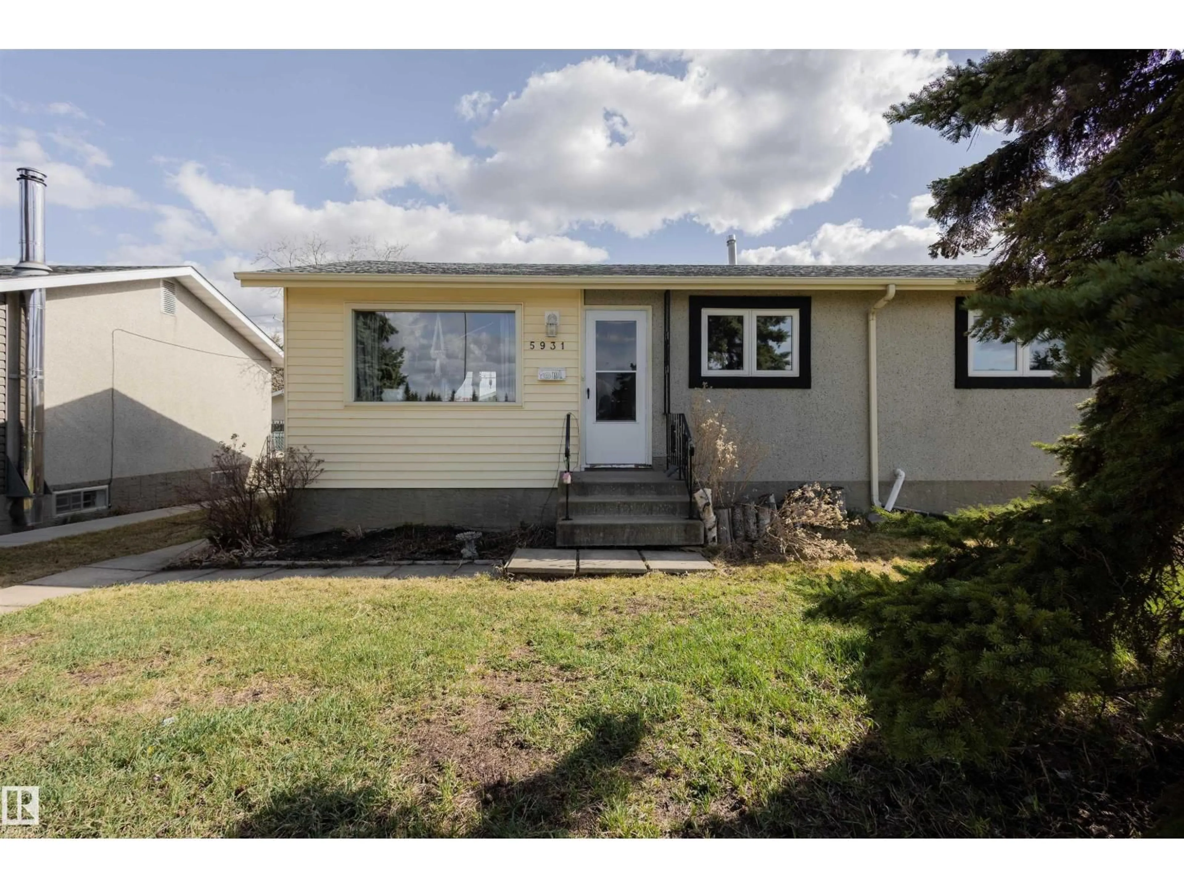 Home with vinyl exterior material, street for 5931 138 AV, Edmonton Alberta T5A1E4