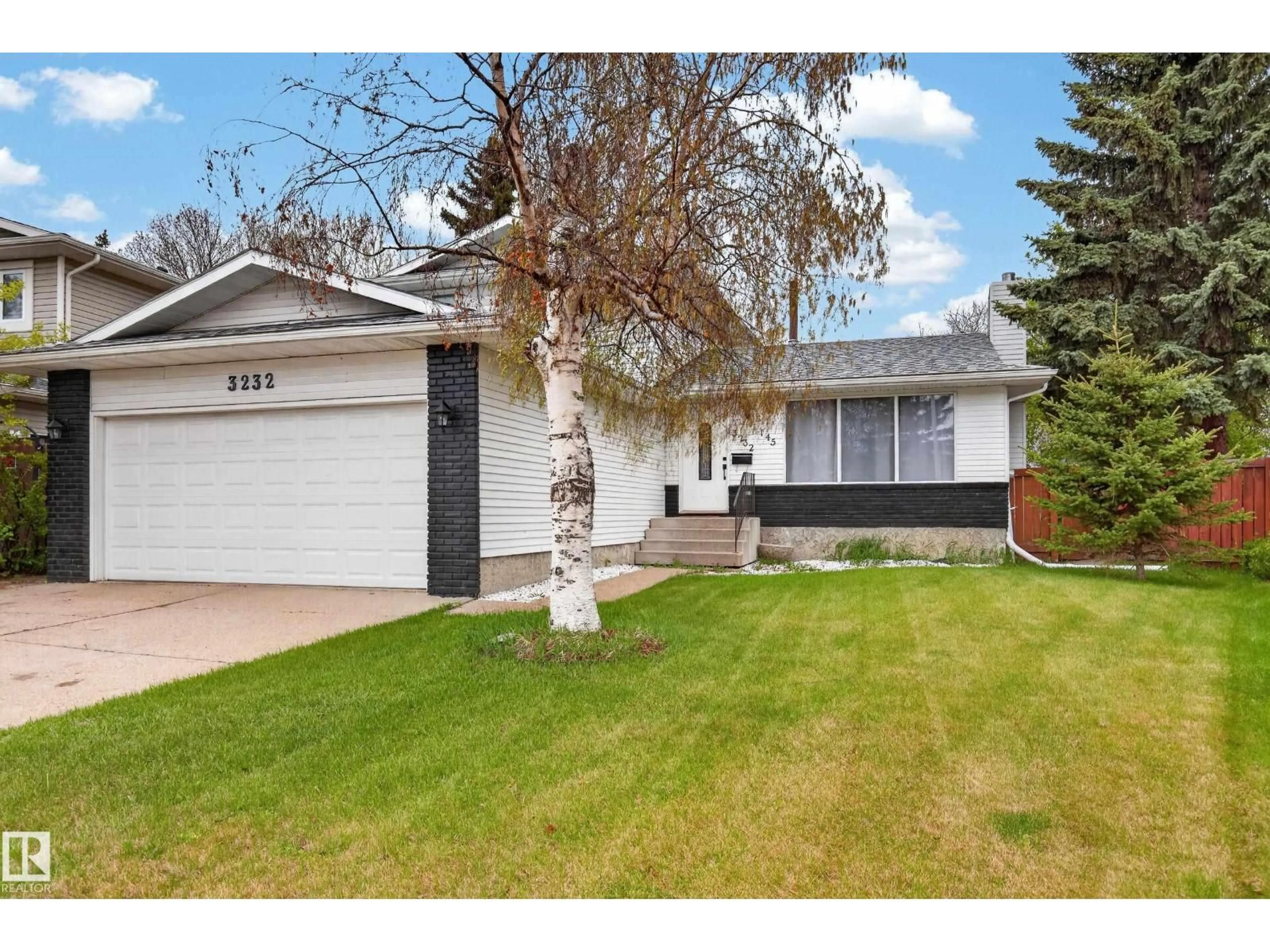 Home with vinyl exterior material, street for NW - 3232 145 AV, Edmonton Alberta T5Y2E5